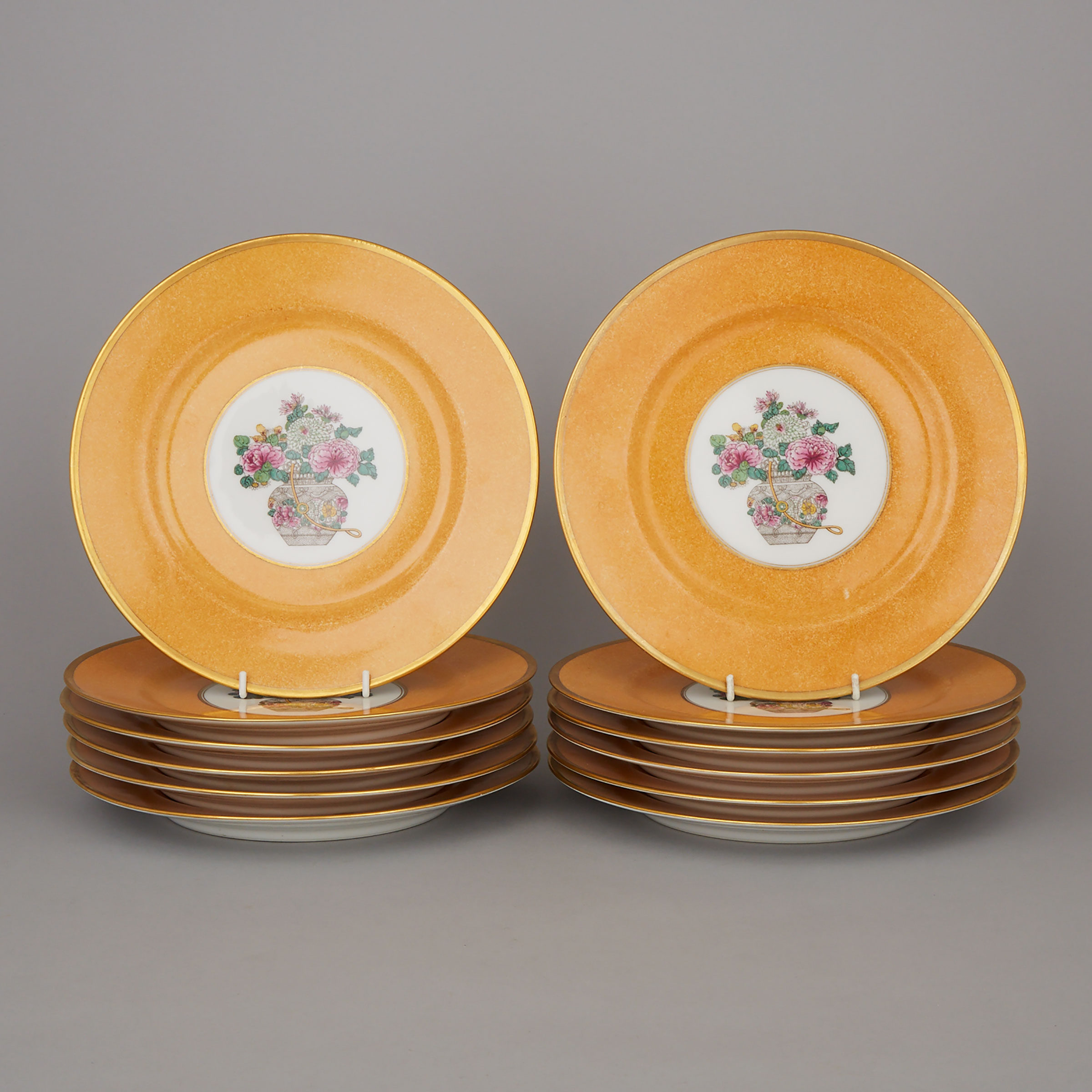 Twelve Bernardaud Limoges Ochre Ground Dinner Plates, for Henry Morgan & Co., Montreal, 20th century