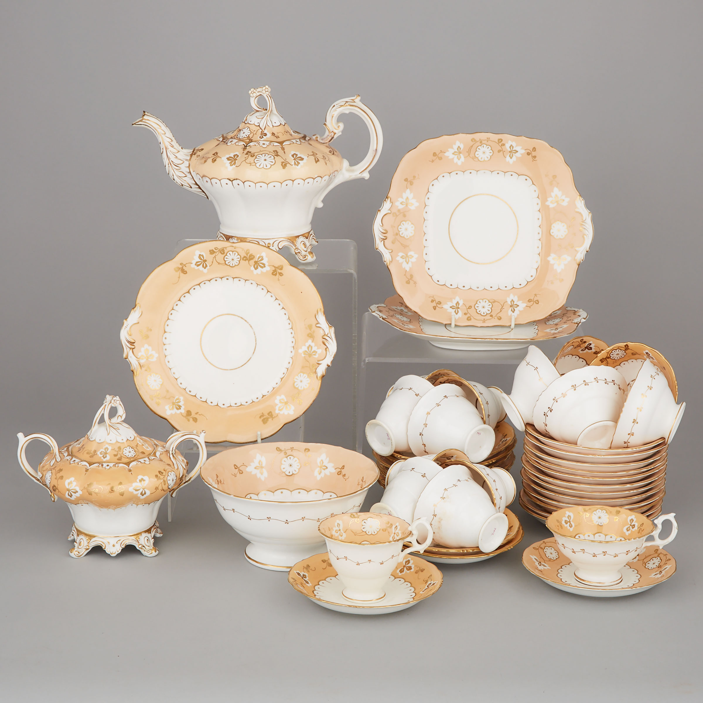 English Porcelain Apricot and Gilt Decorated Part Tea Service, mid-19th century
