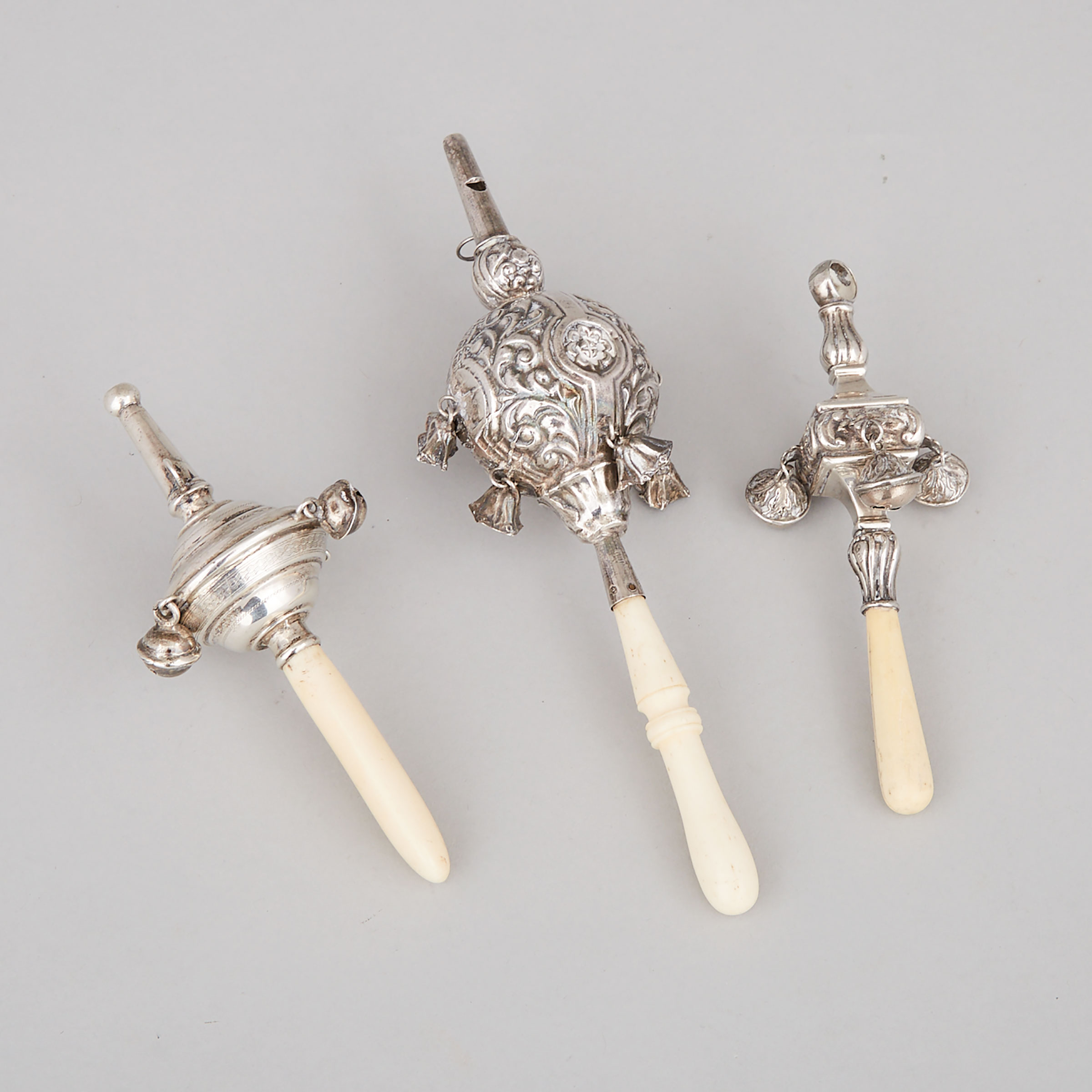 Three English and Continental Silver Child’s Rattles and Whistles, late 19th/20th century