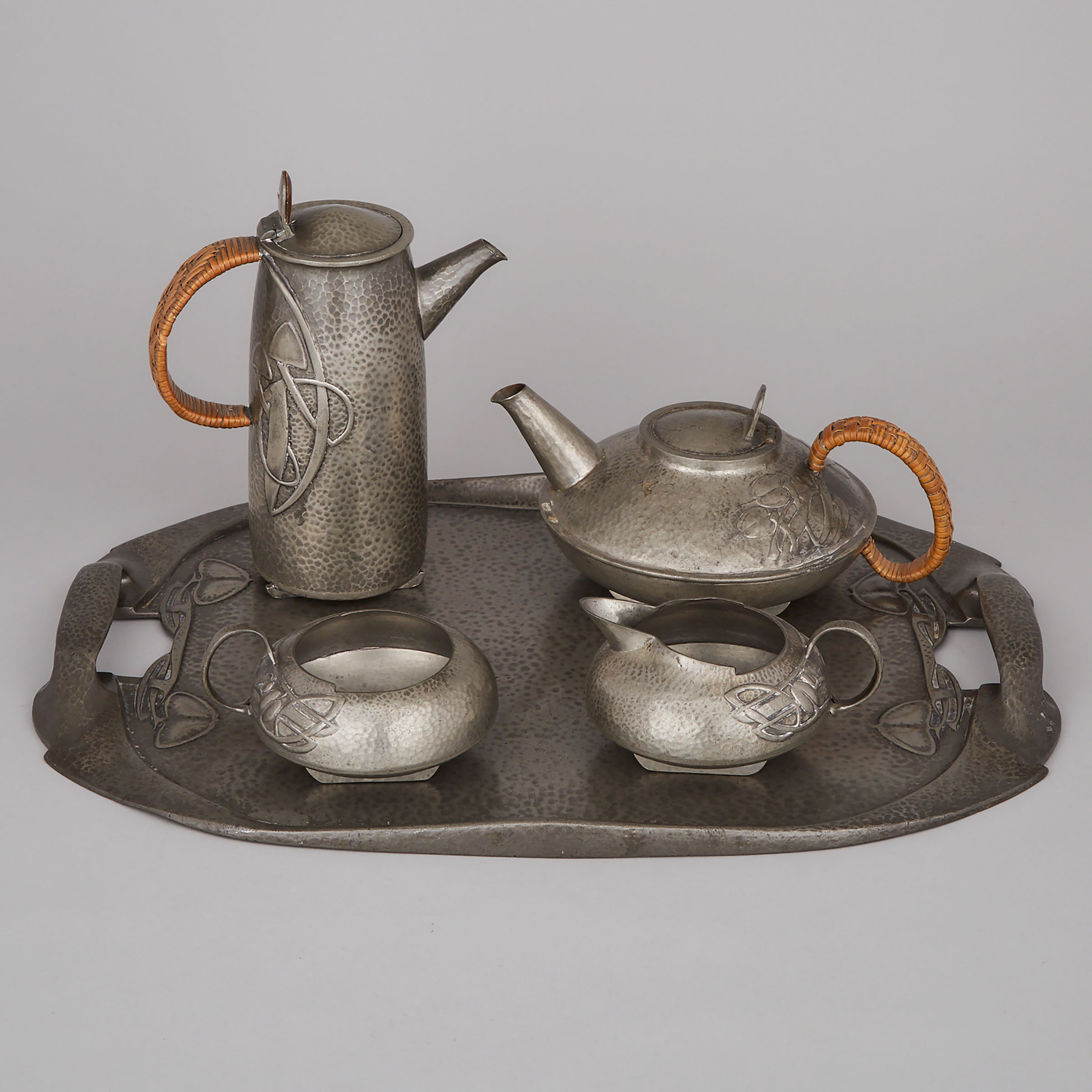 Archibald Knox Five Piece ‘Tudric’ Pewter Tea Service, for Liberty & Co., London, early 20th century