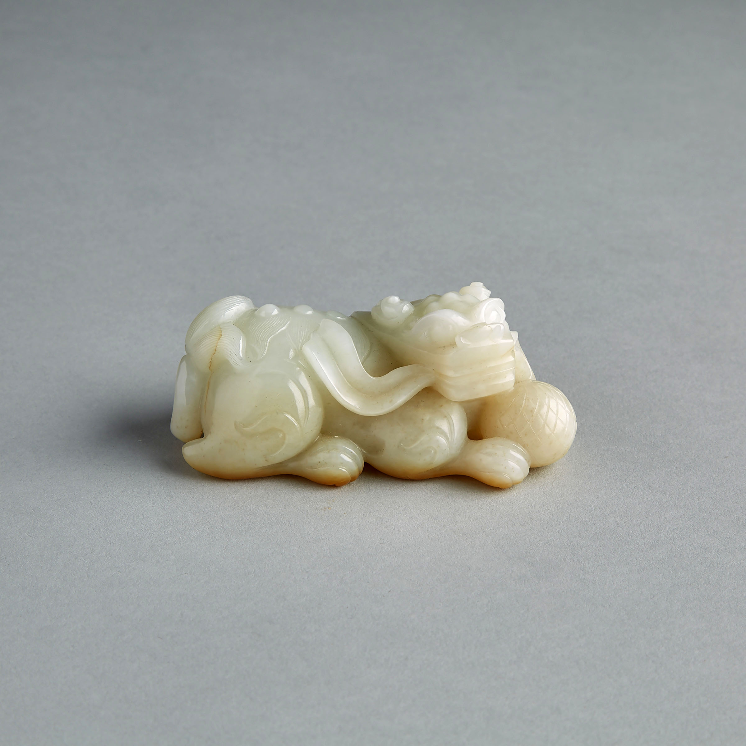 A White and Russet Jade Lion Carving 