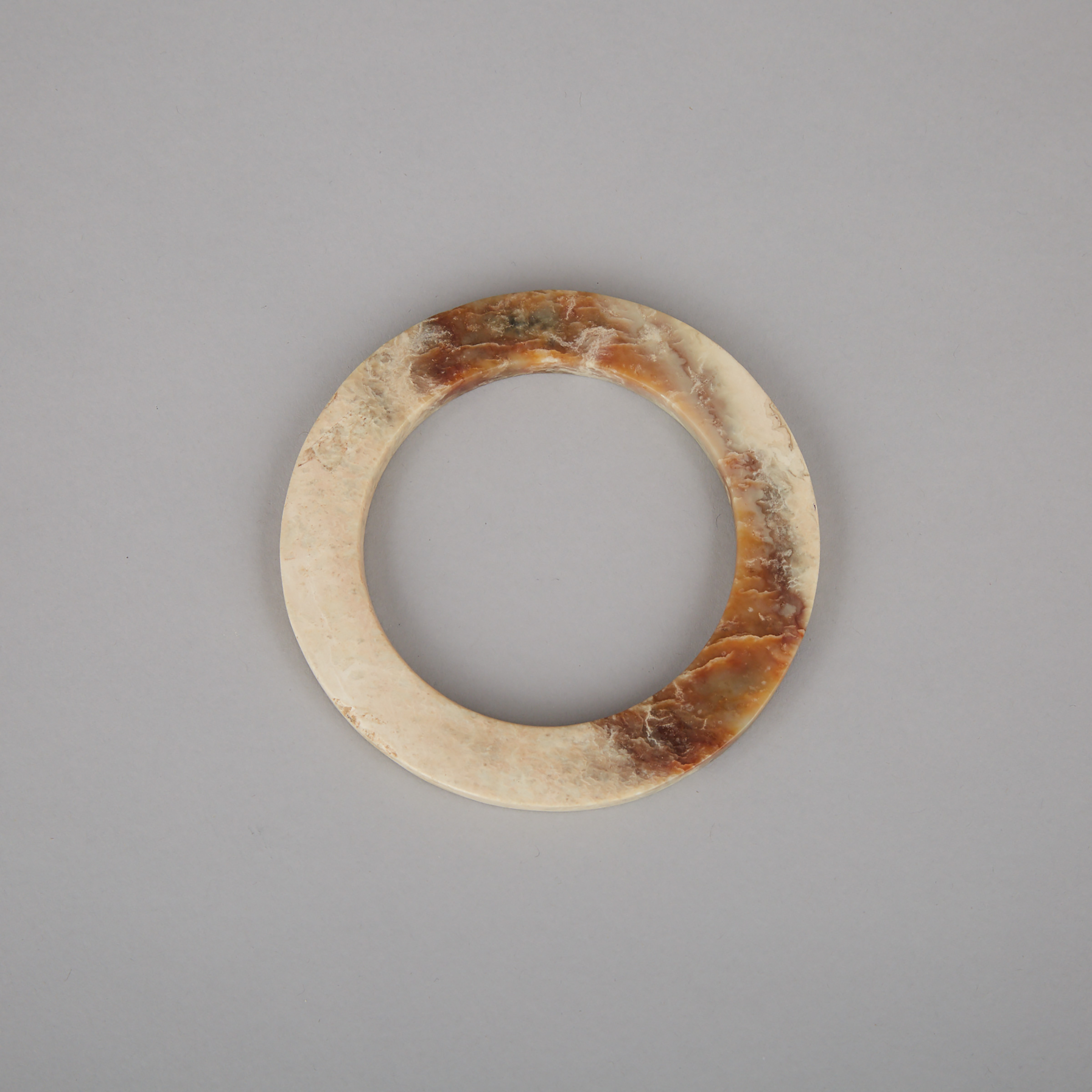 A Chinese Archaic Jade Disc Bracelet, Neolithic Period