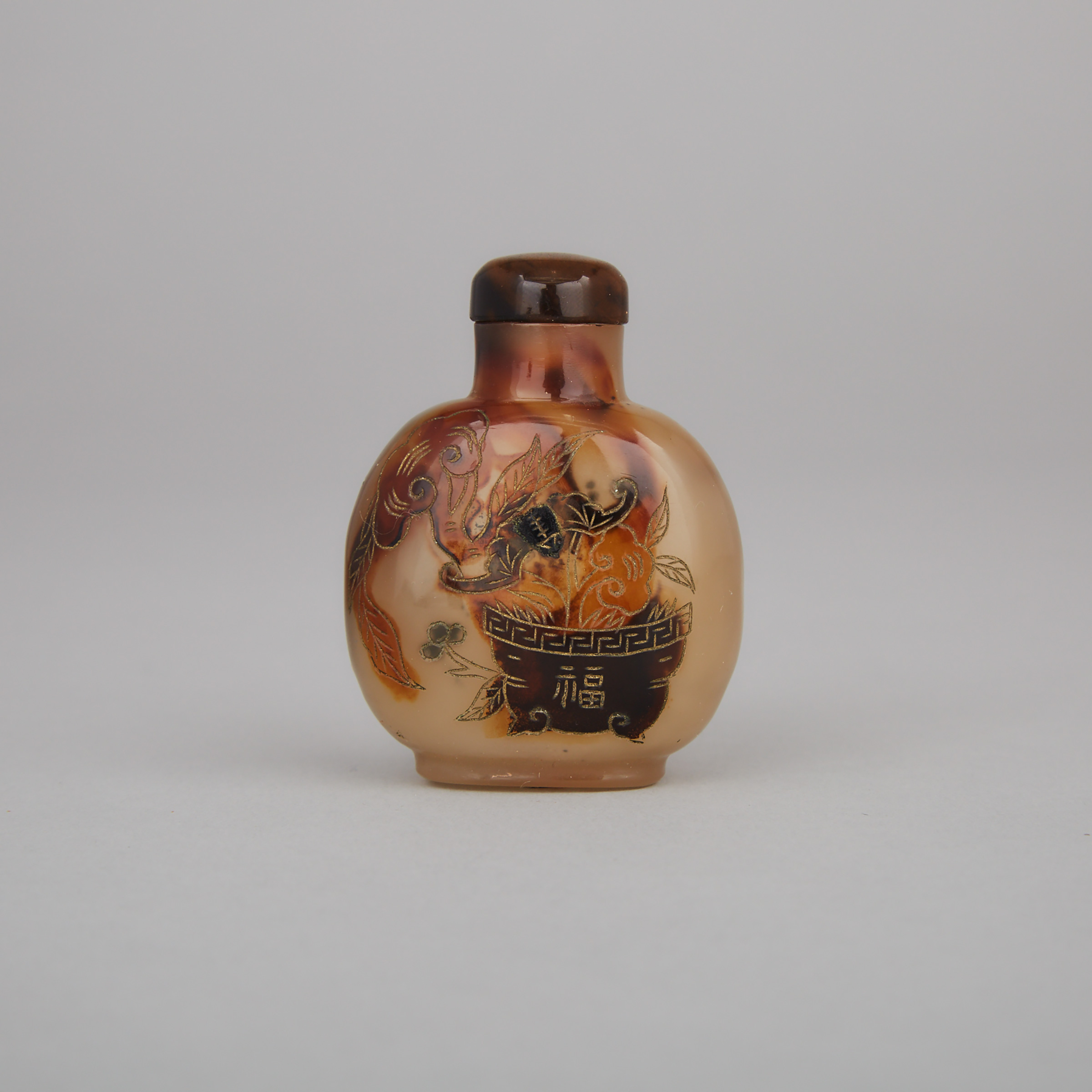 A Finely Carved and Gilt Shadow Agate Snuff Bottle, 18th/19th Century