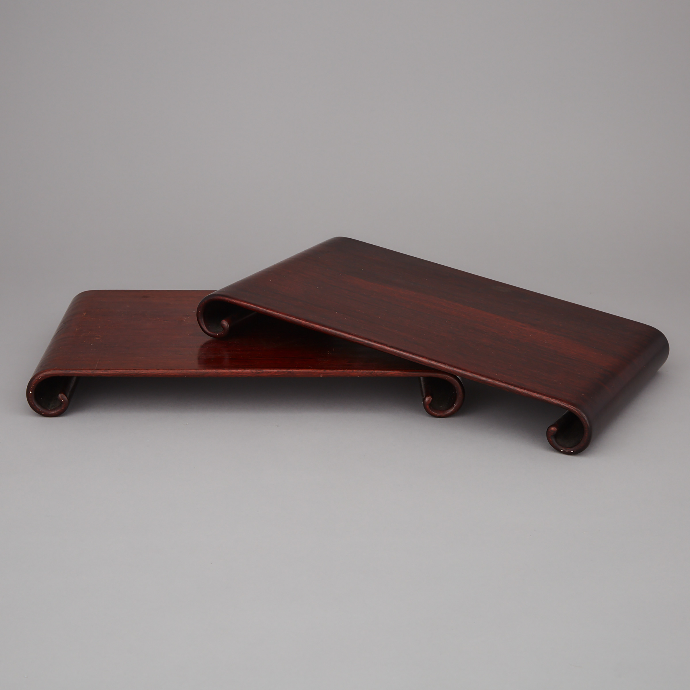 A Pair of Hardwood Carved Scroll-End Stands