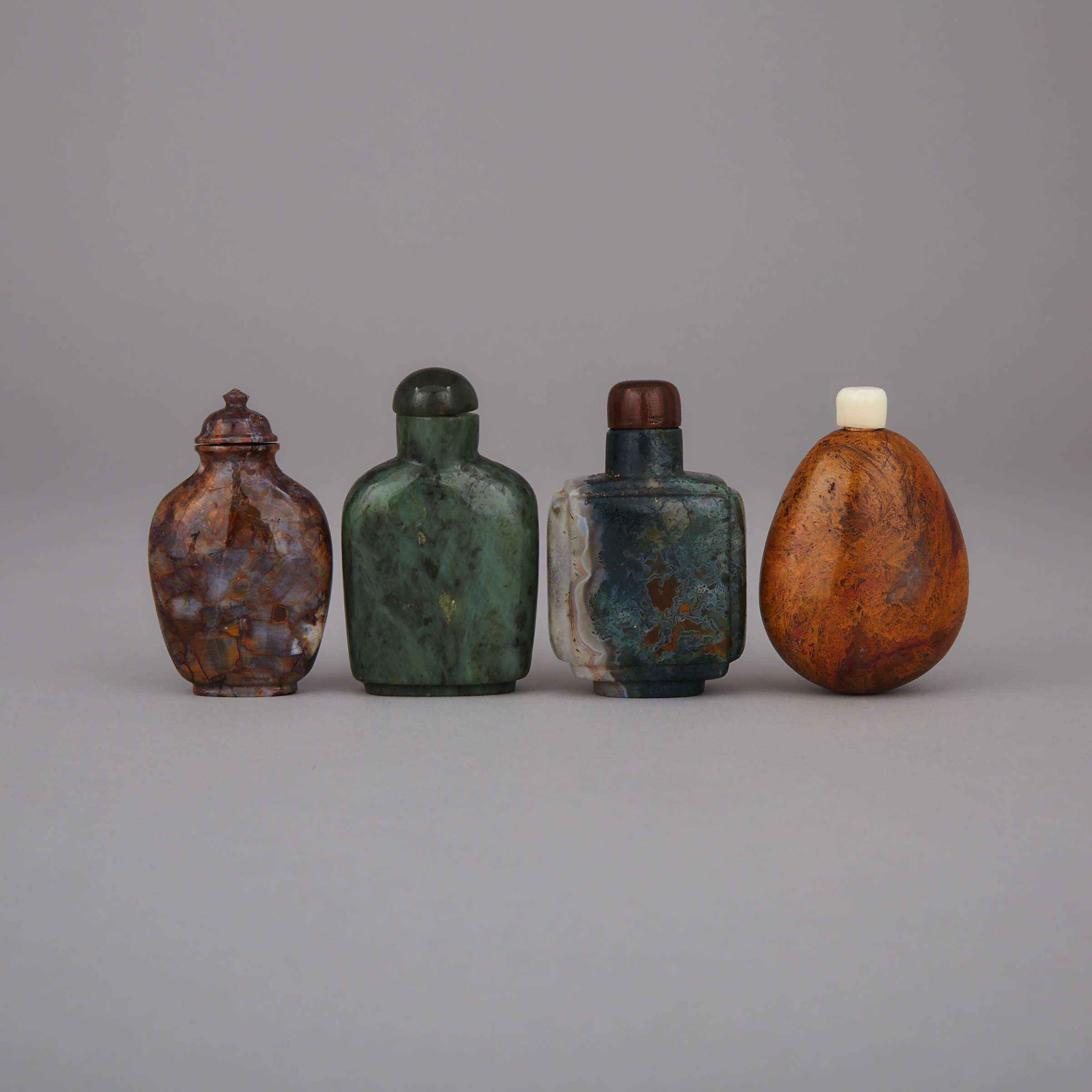 A Group of Four Hardstone Snuff Bottles