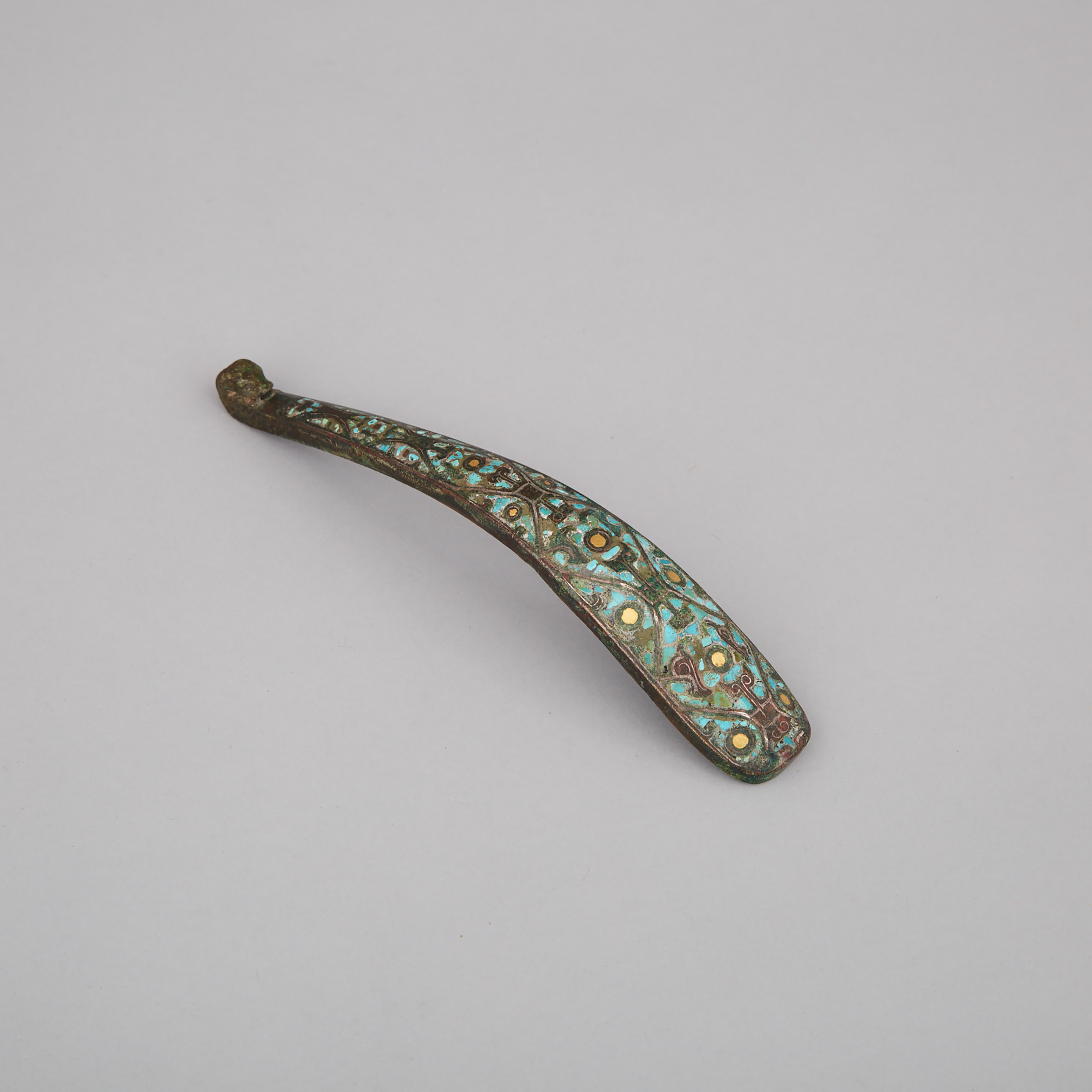 A Gold, Silver and Turquoise Inlaid Bronze Belthook, Warring States Period, 5th to 3rd Century BC