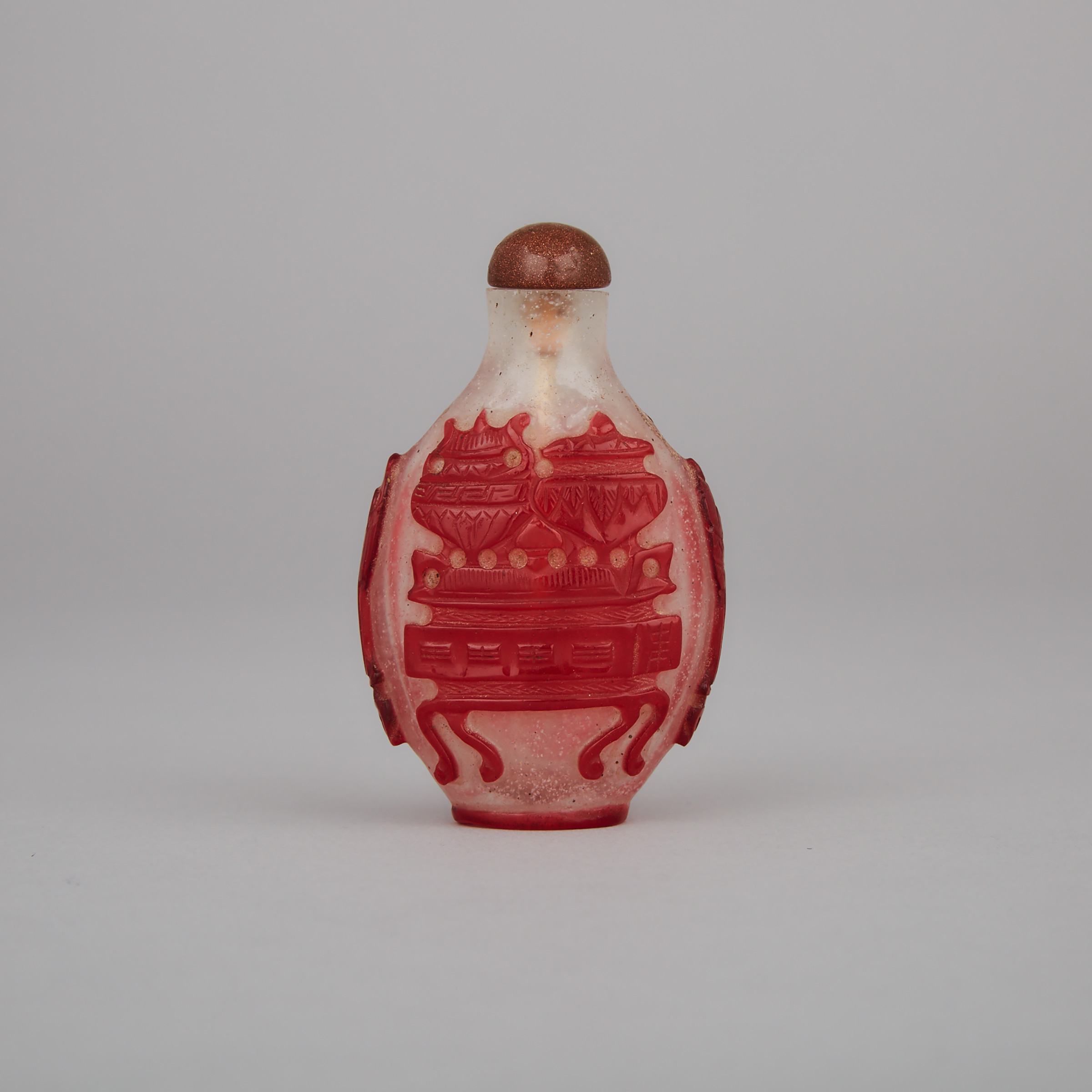 A Red-Overlay ‘Precious Objects’ Peking Glass Snuff Bottle, 19th Century