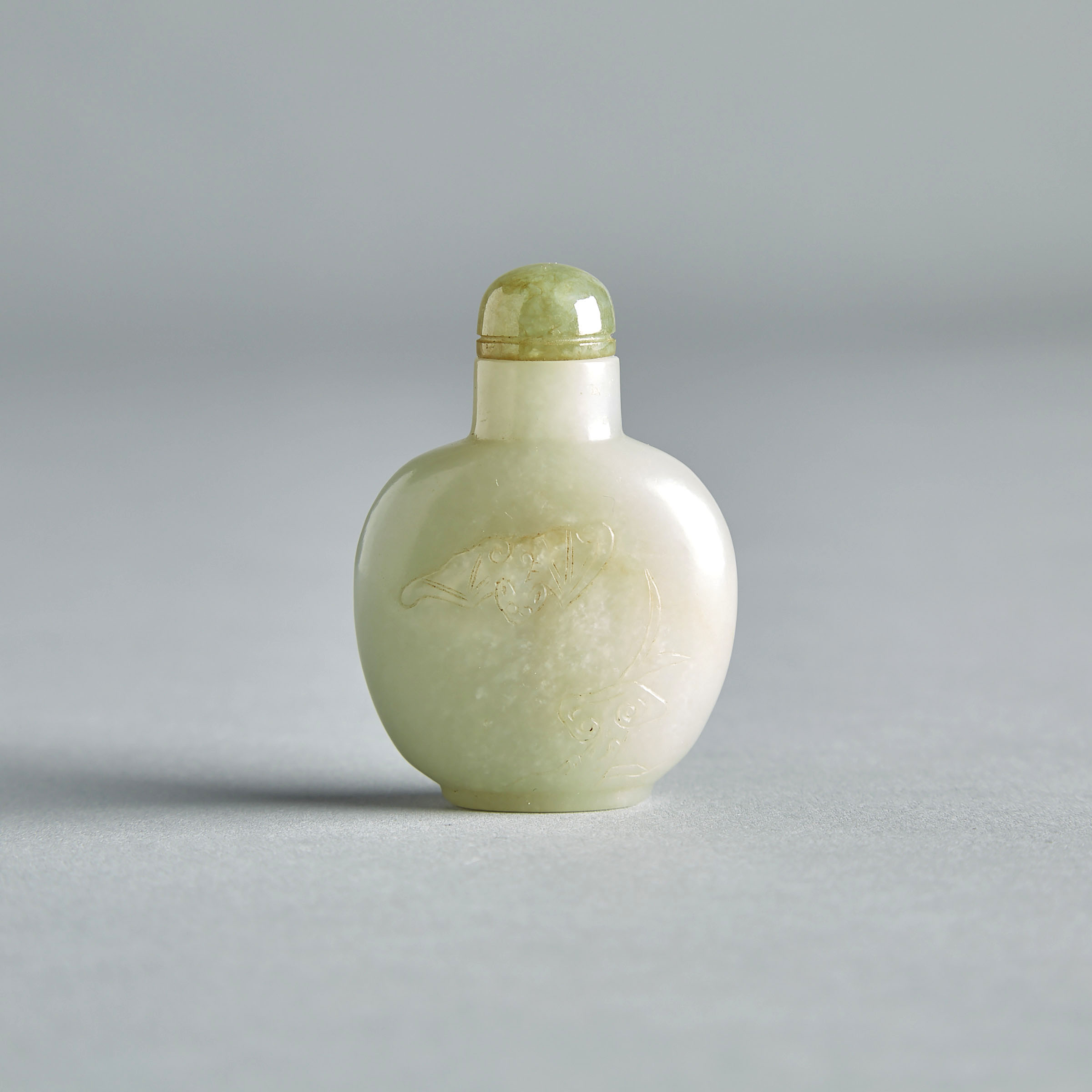 A Pale Celadon Jade ‘Bat and Ruyi’ Snuff Bottle, 18th/19th Century