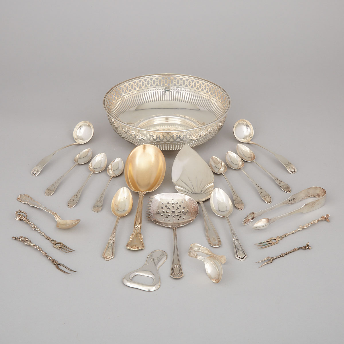 Twenty-One Pieces of American, Canadian, Scottish and Continental Silver Flatware and a Pierced Bowl, 19th-20th century