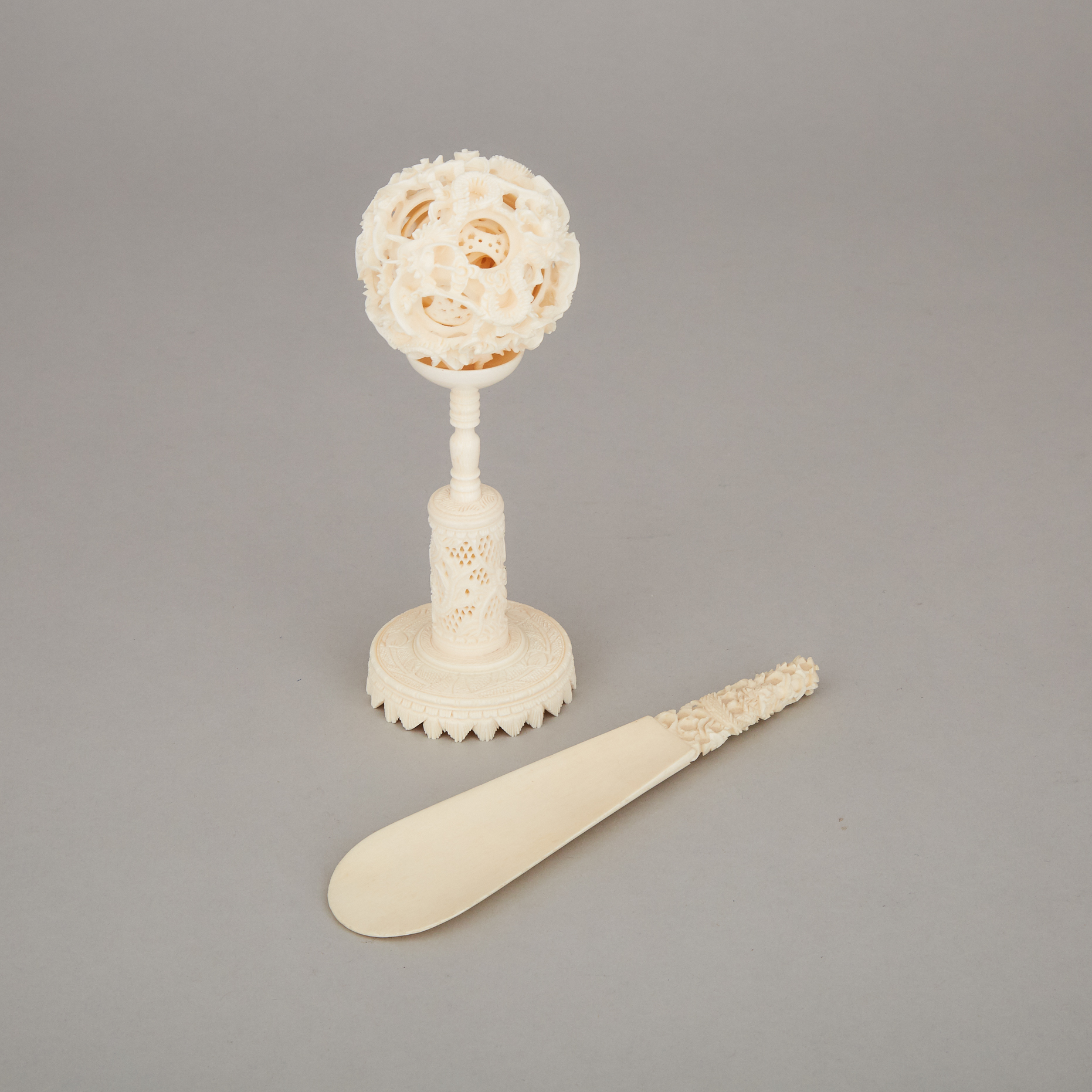 An Ivory Carved Puzzle Ball and Stand