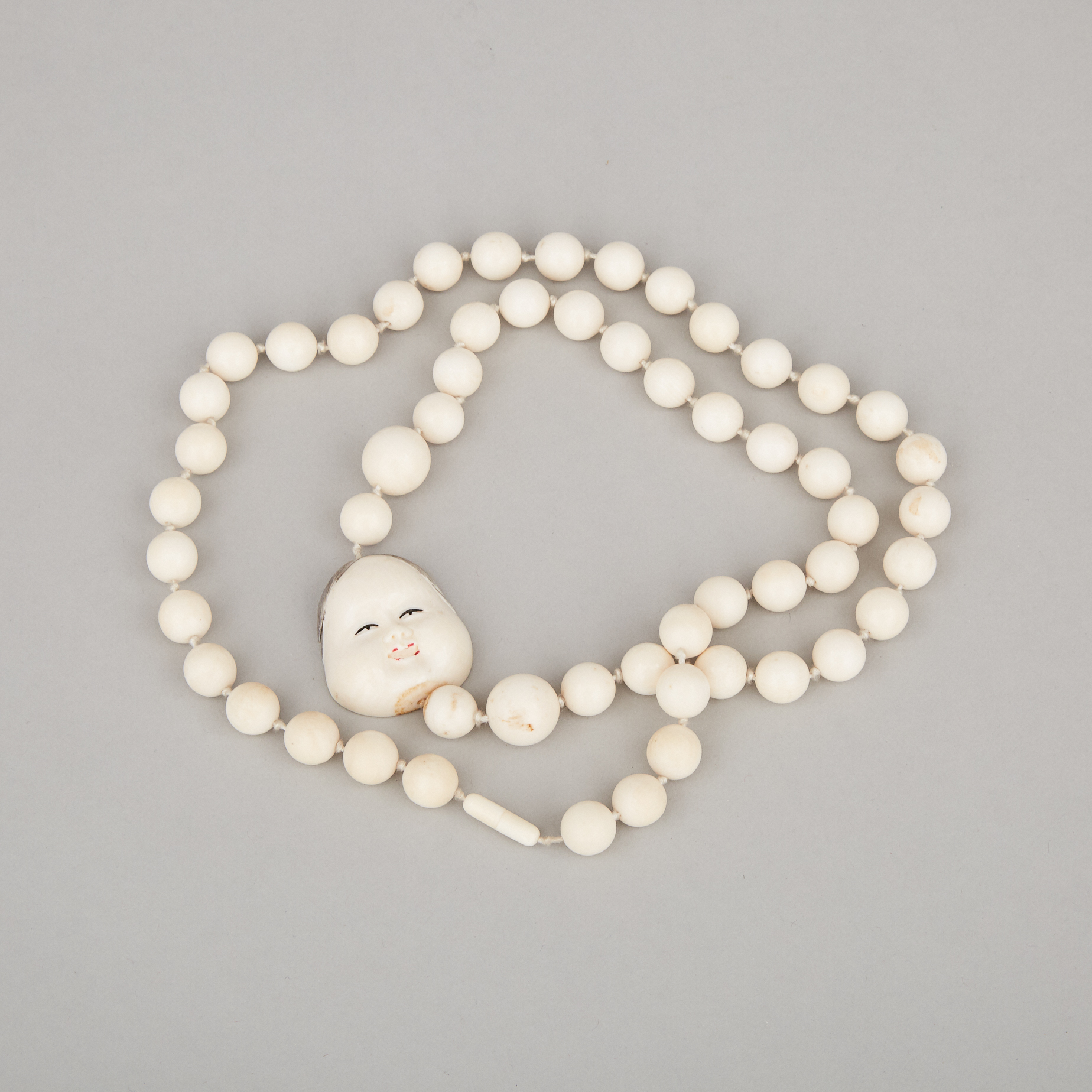 An Ivory Japanese Mask Beaded Necklace, Circa 1940