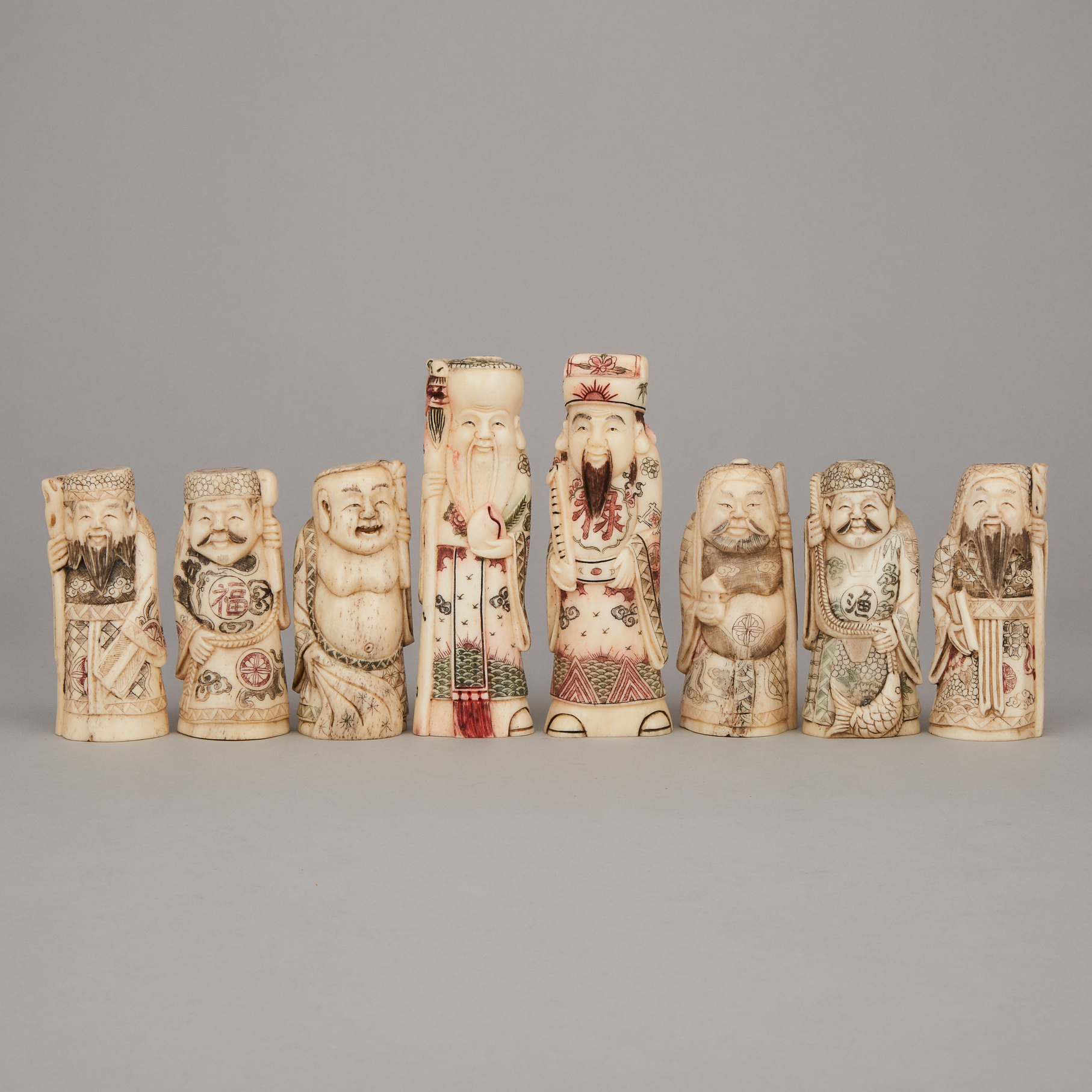 A Group of Eight Bone Carved Immortals