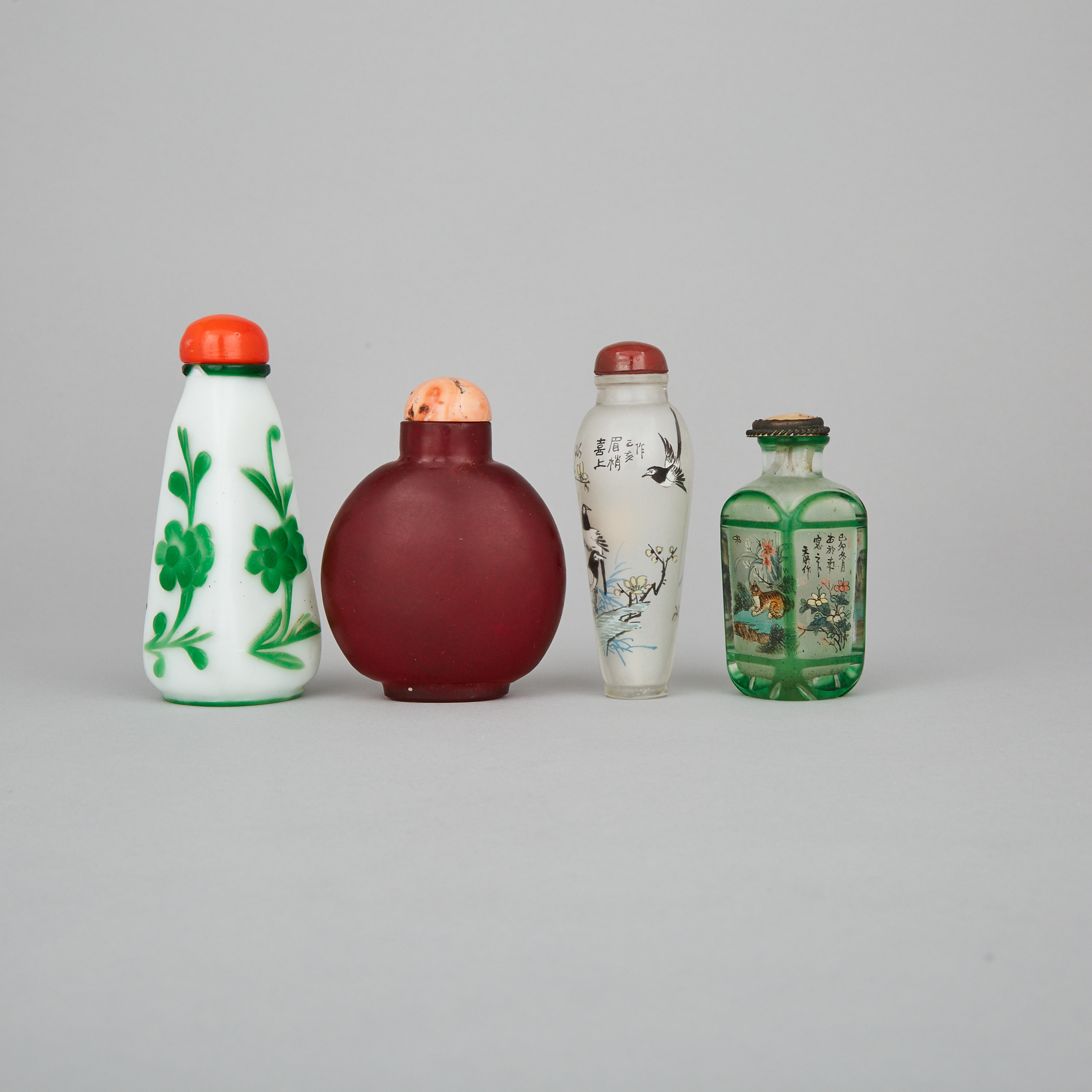 A Group of Four Glass Snuff Bottles