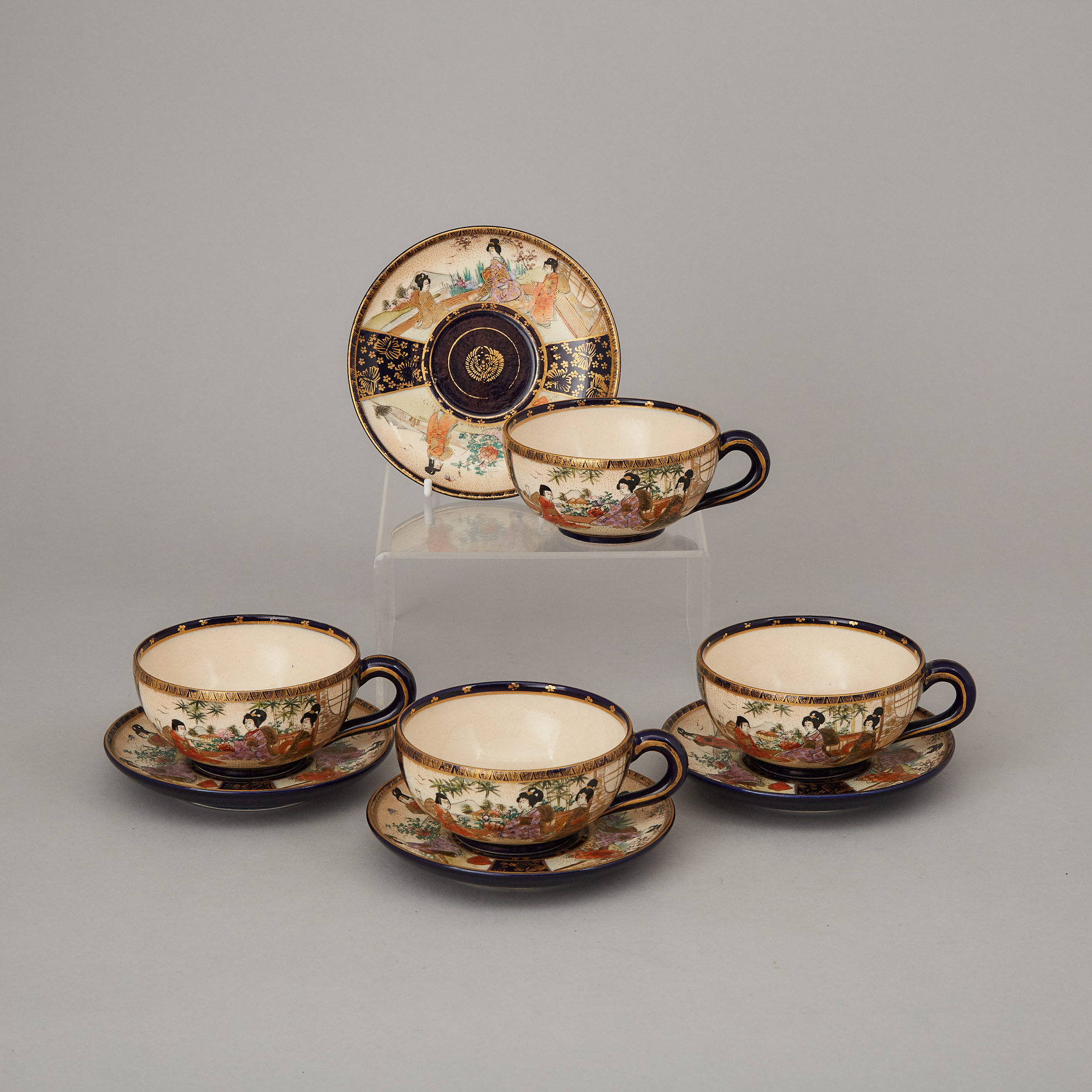 A Set of Four Blue Ground Satsuma Teacups and Saucers