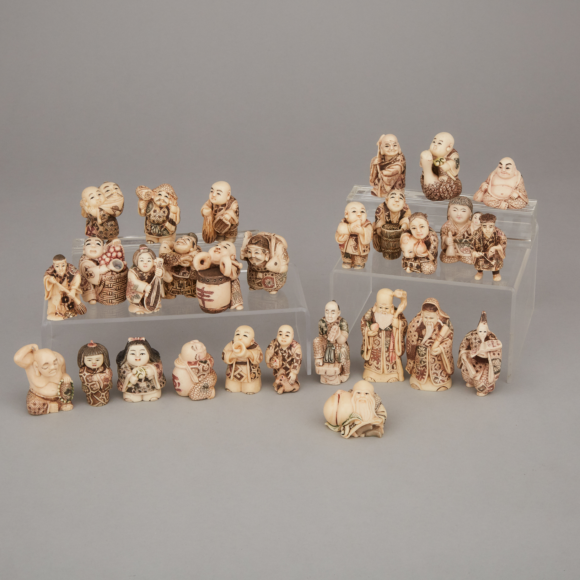A Group of Twenty-Eight Ivorine Carved Figures