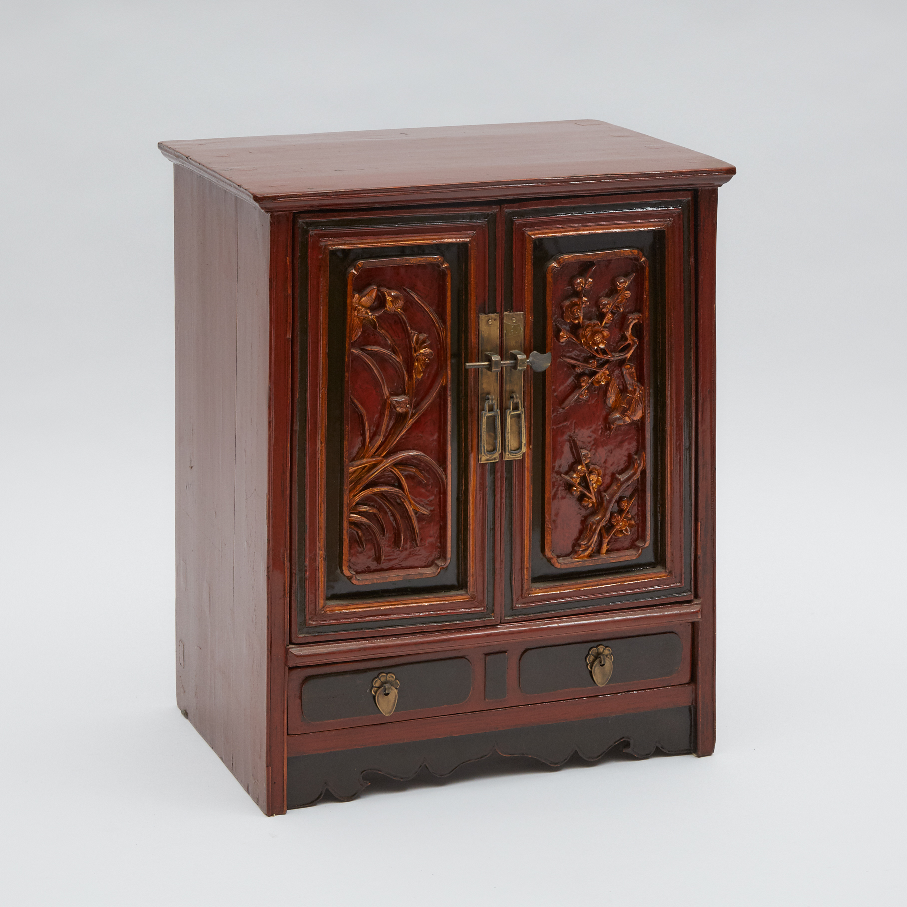 A Small Red Lacquer Cabinet