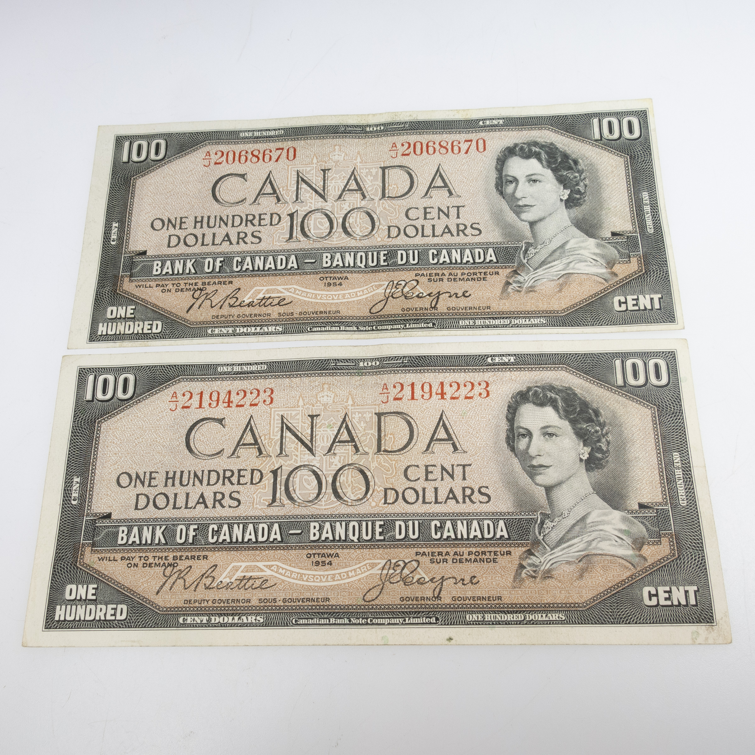 2 Canadian 1954 $100 "Devil's Face" Banknotes