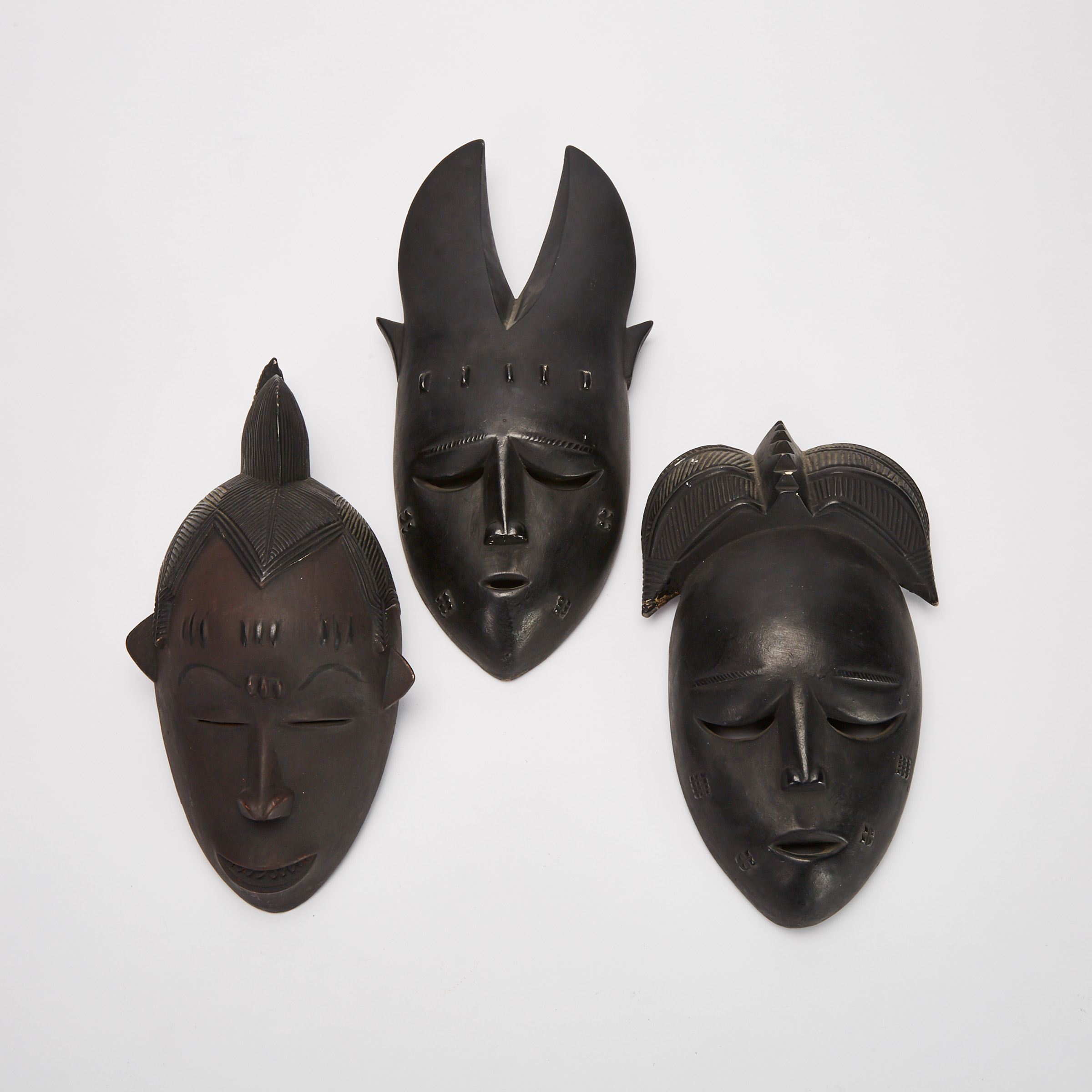 Three Baule Anthropo-zoomorphic Painted Plaster Masks, Ivory Coast, West Africa