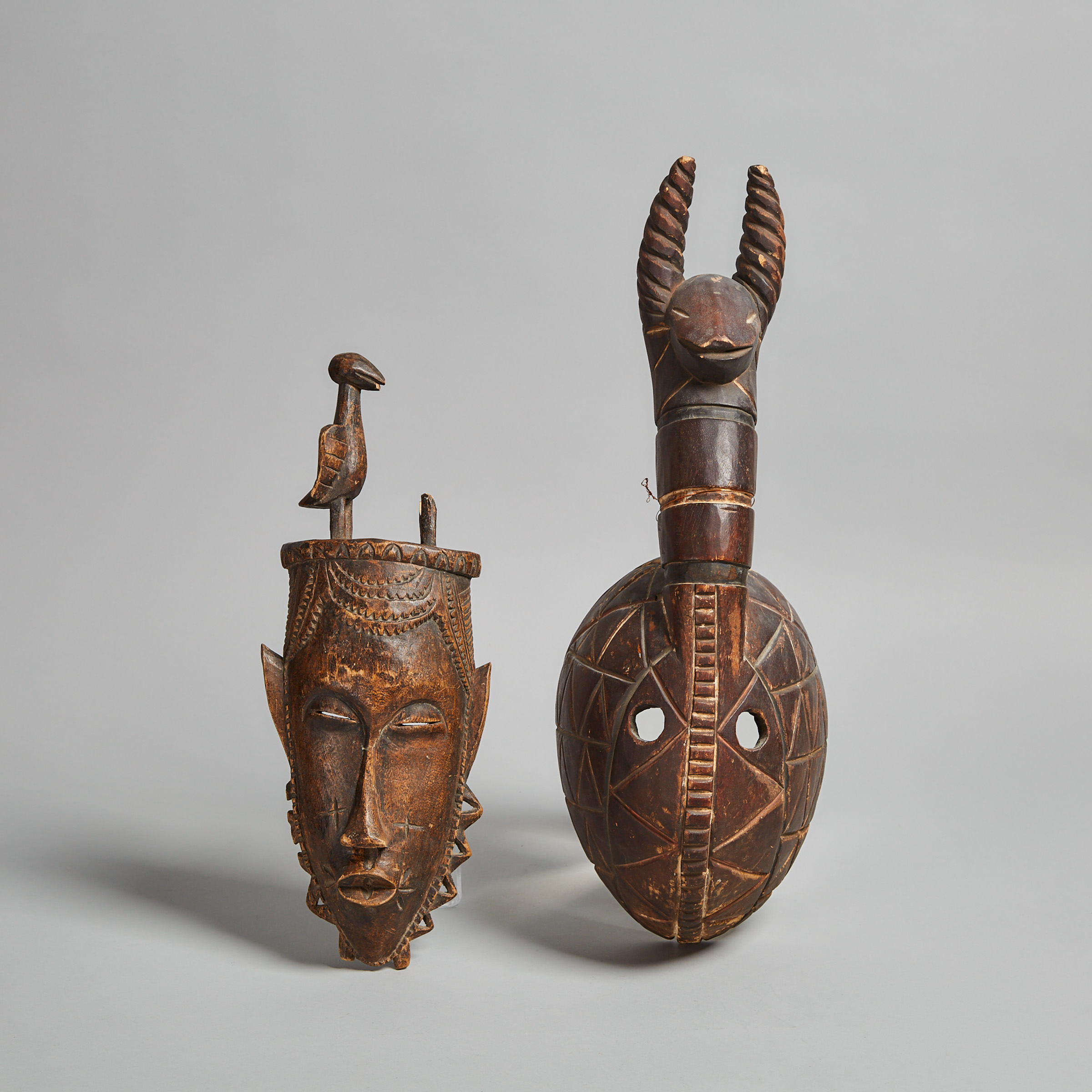 Yaure Mask together with a Modern Mask, possibly Dogon, Africa