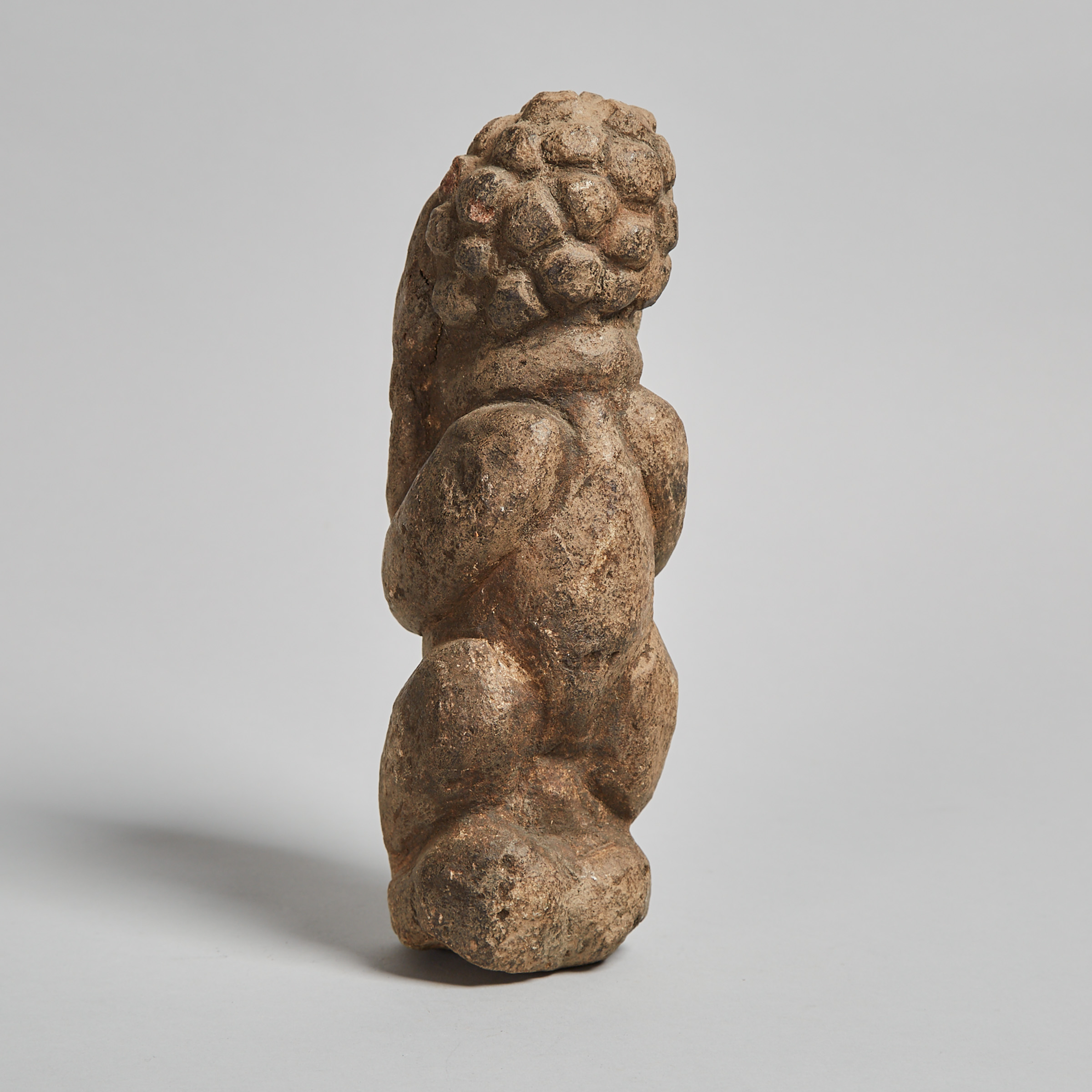 Carved Granite Kneeling Figure, Cameroon, West Africa, possibly 19th/ early 20th century