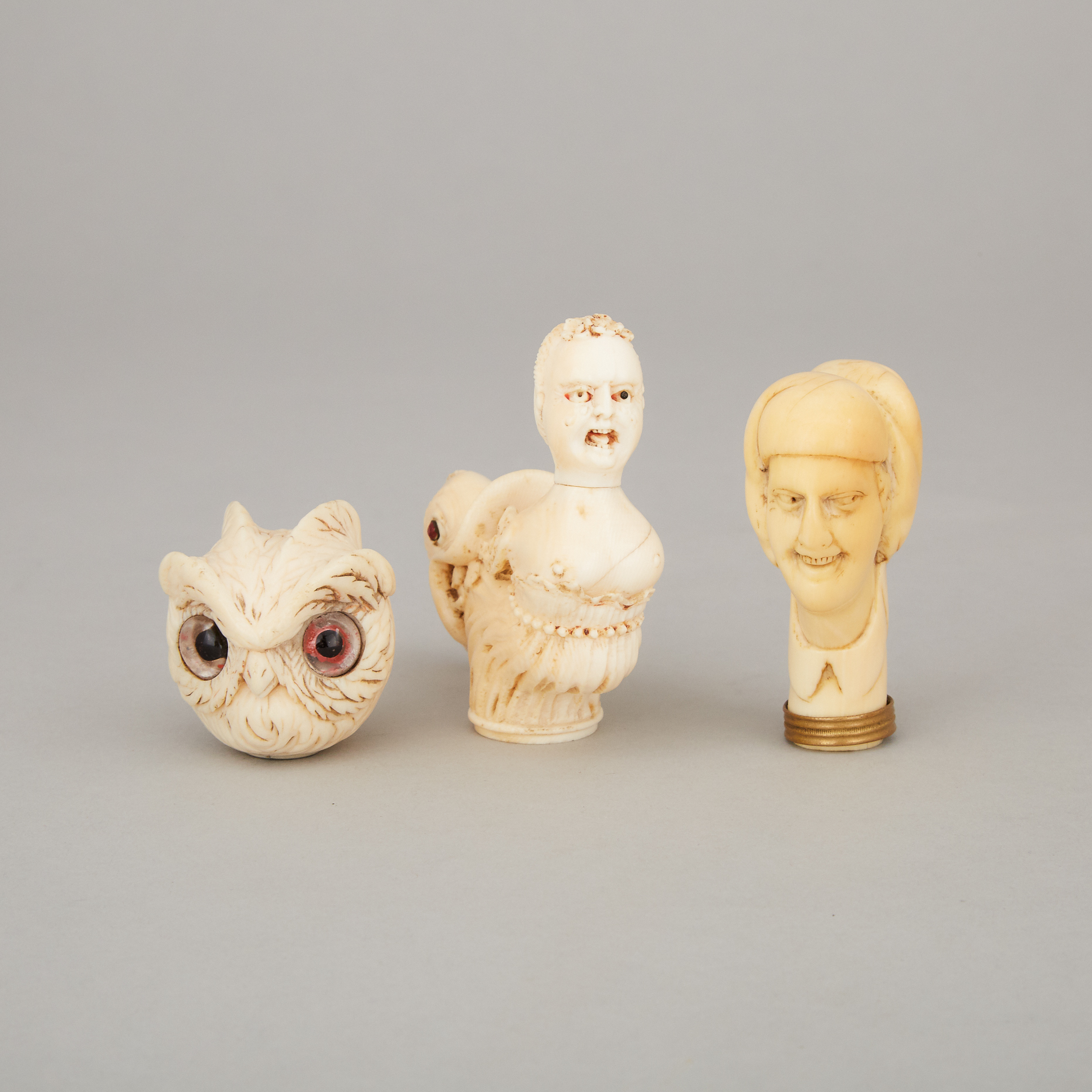 Three Victorian Carved Ivory Parasol Handles, mid 19th century