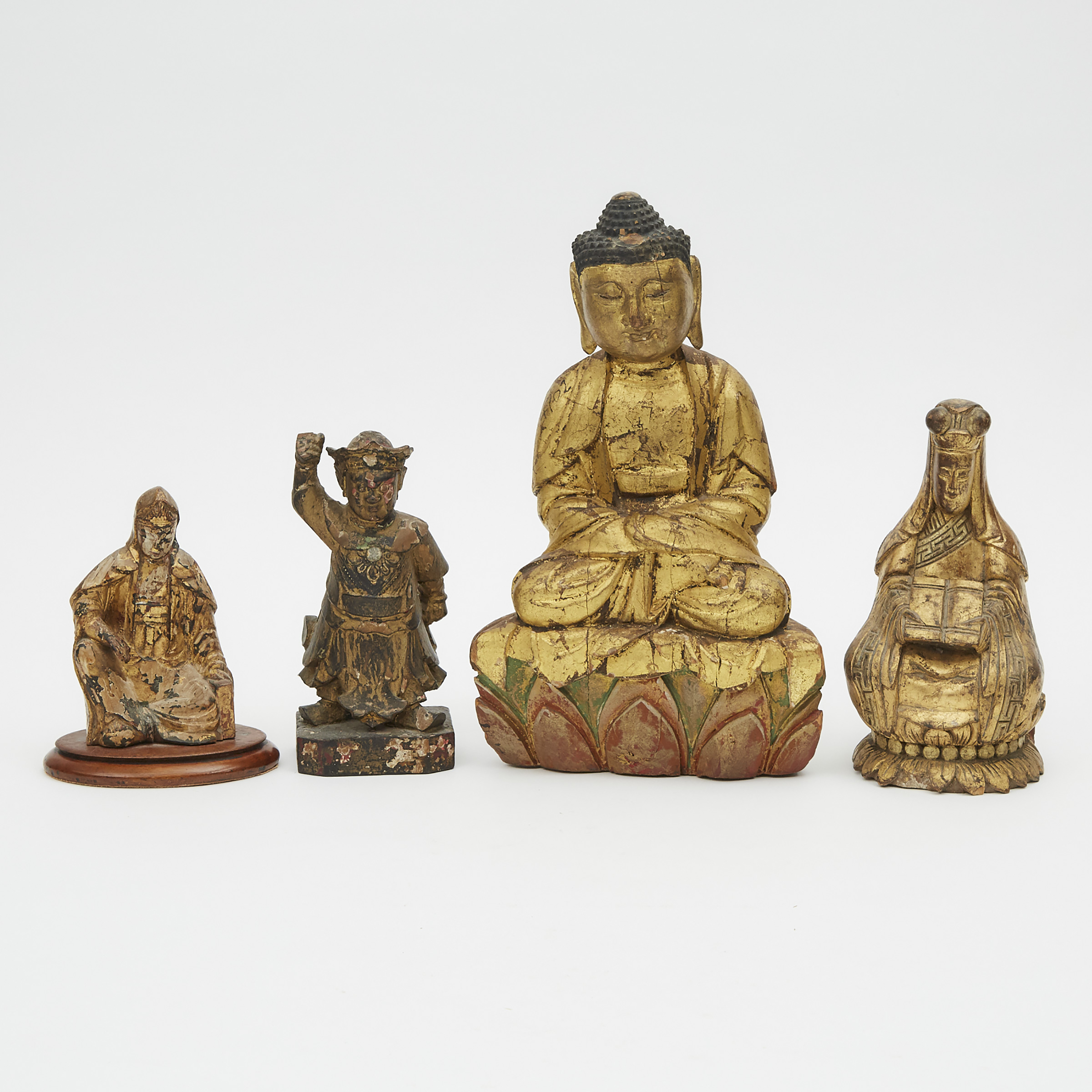 A Group of Four Gilt Lacquer Wood Figures, 18th Century and Later