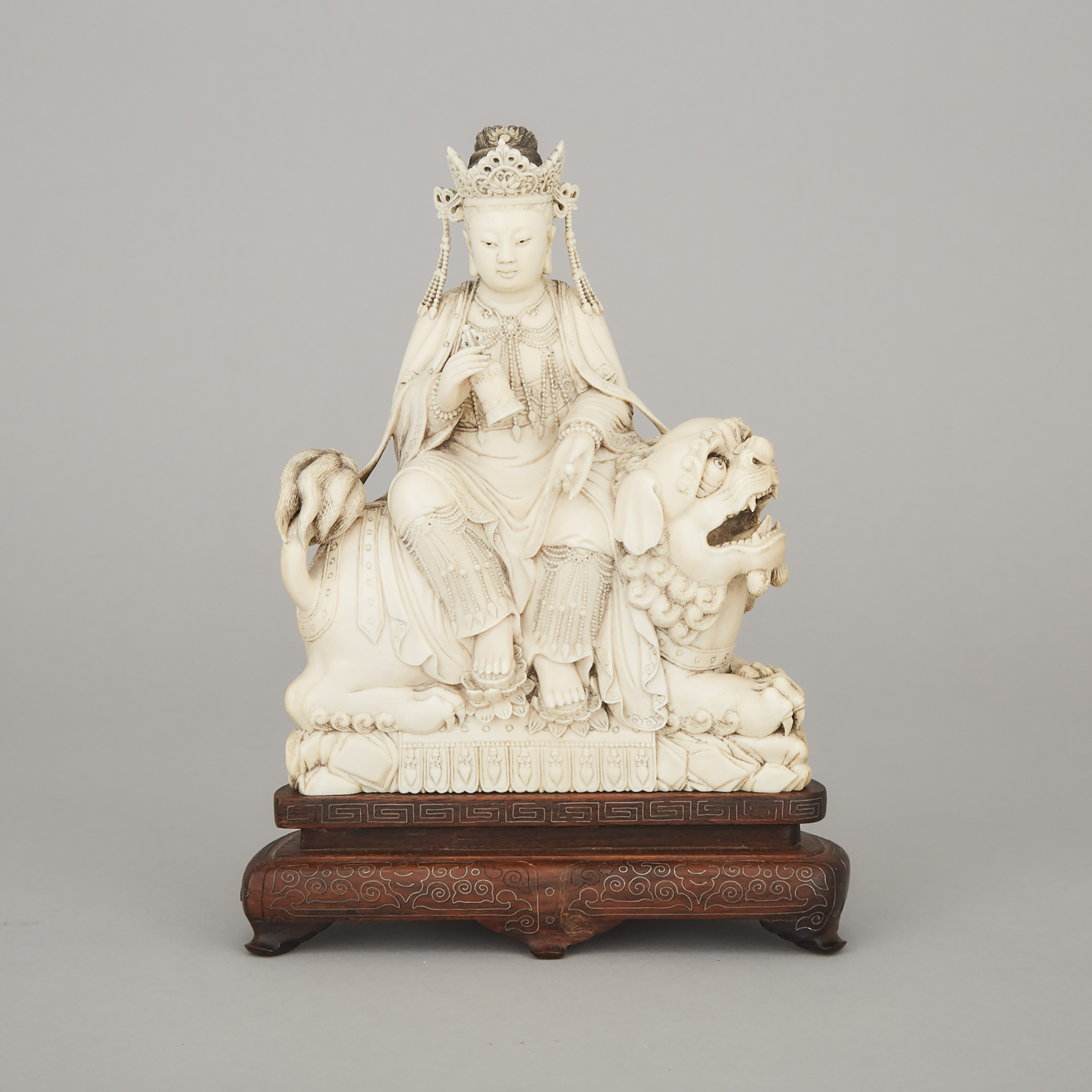 A Finely Carved Ivory Figure of Manjushri Seated on a Lion, Early 20th Century
