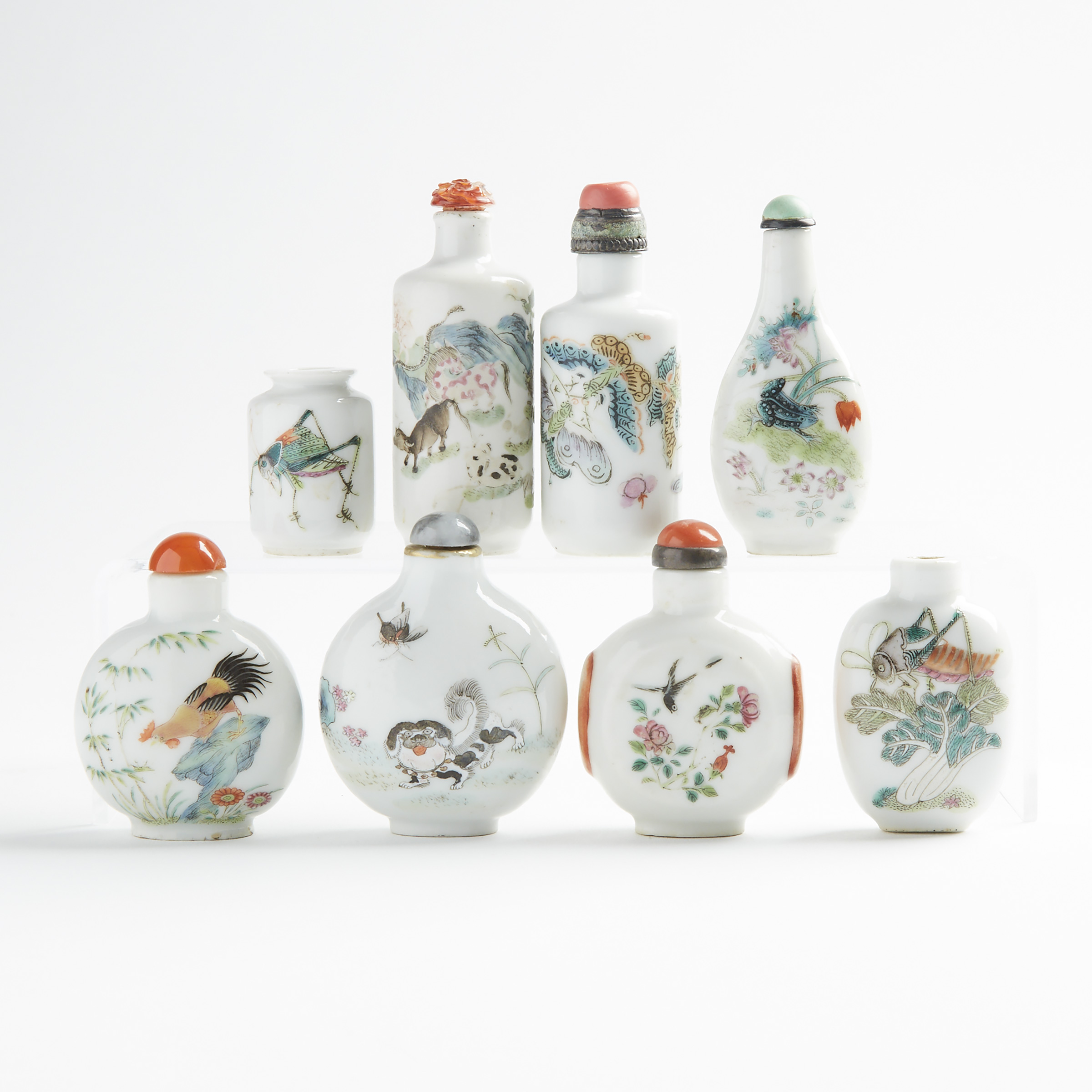 A Group of Eight Enameled Porcelain Snuff Bottles, 19th/20th Century