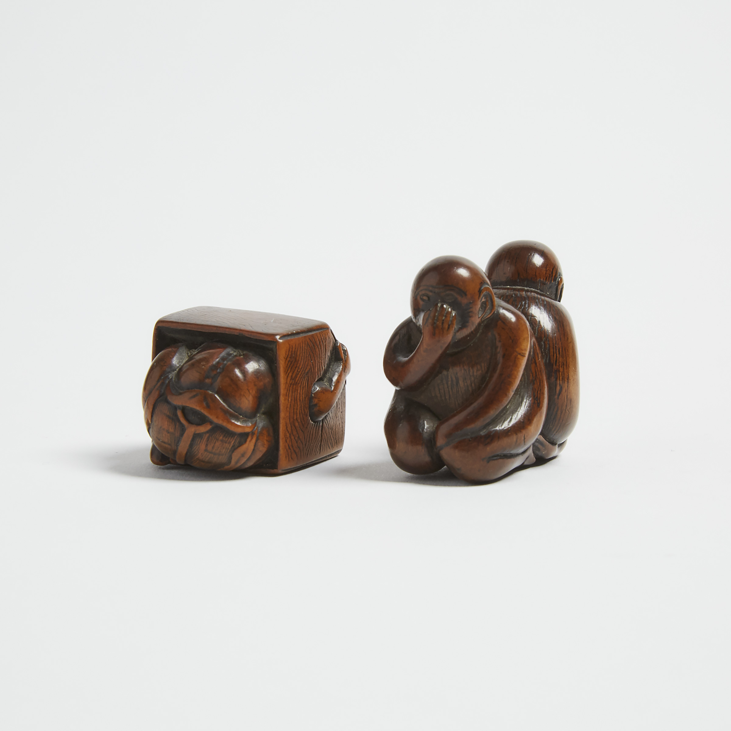 Two Wood Netsuke of an Oni in a Box and Monkeys, 18th/19th Century
