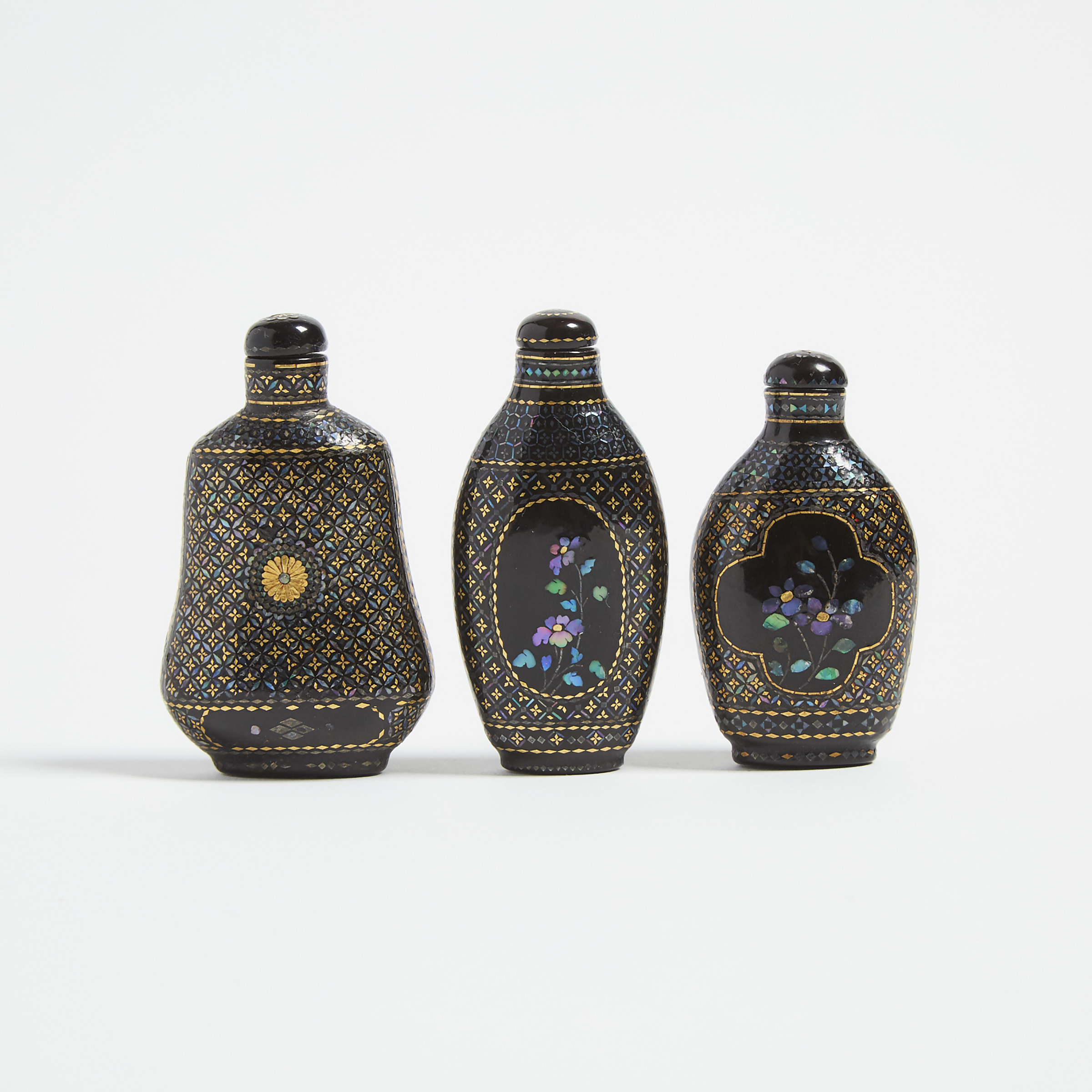 A Group of Three Lac Burgauté Snuff Bottles, 19th/Early 20th Century