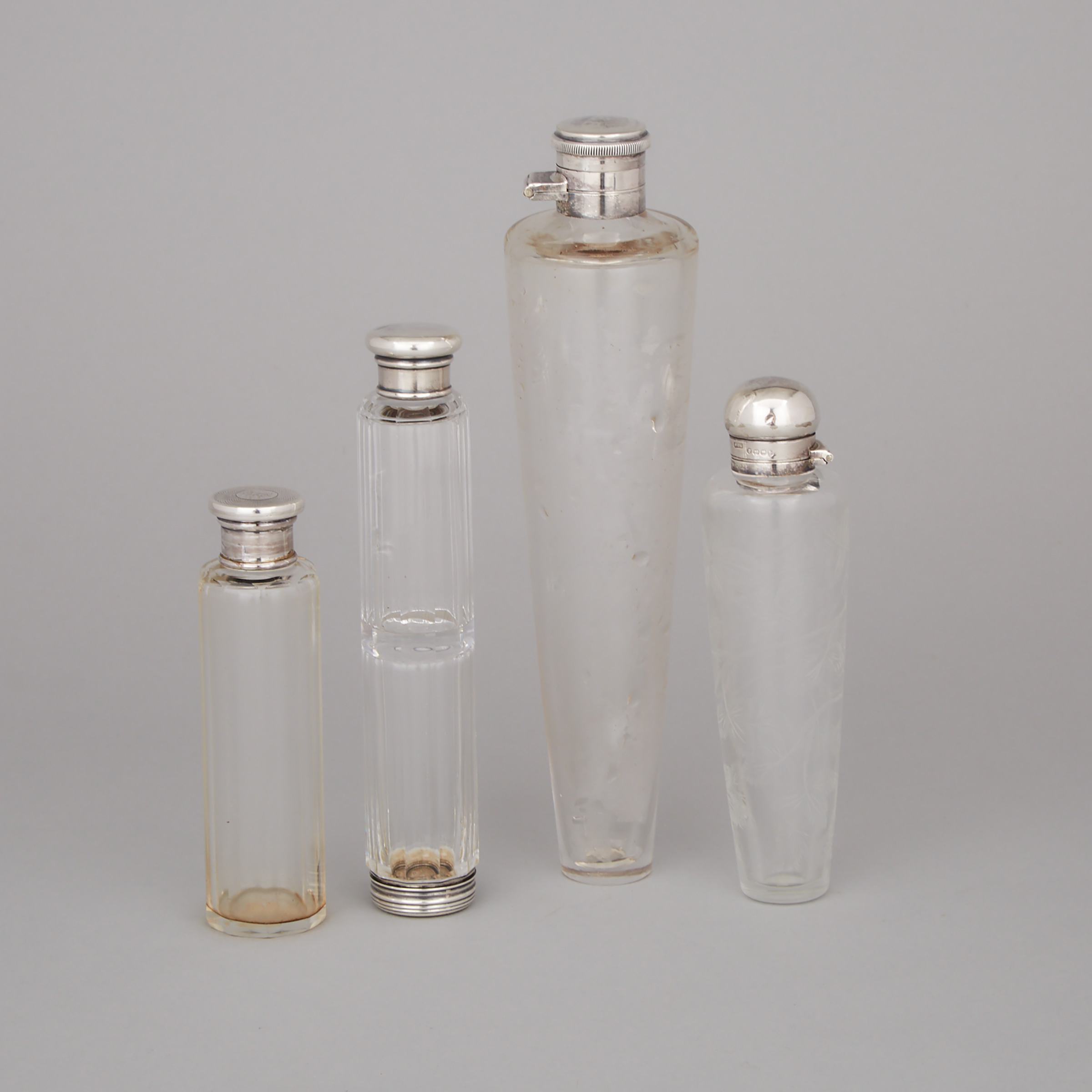 Four Victorian and Later English Silver Mounted Glass Large Perfume and Toilet Water Phials, late 19th/early 20th century