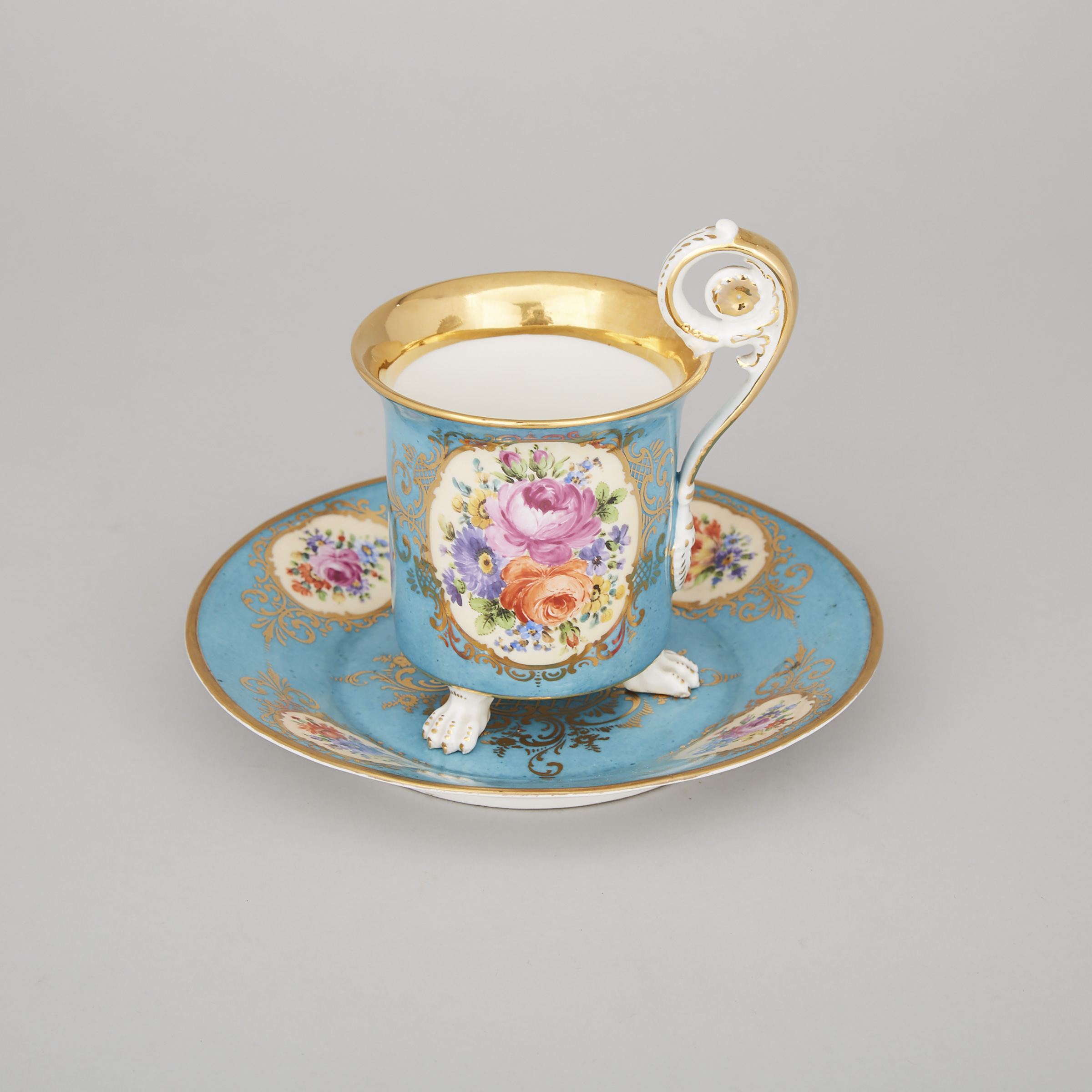 Berlin Floral Paneled Blue and Gilt Ground Cup and Saucer, c.1900