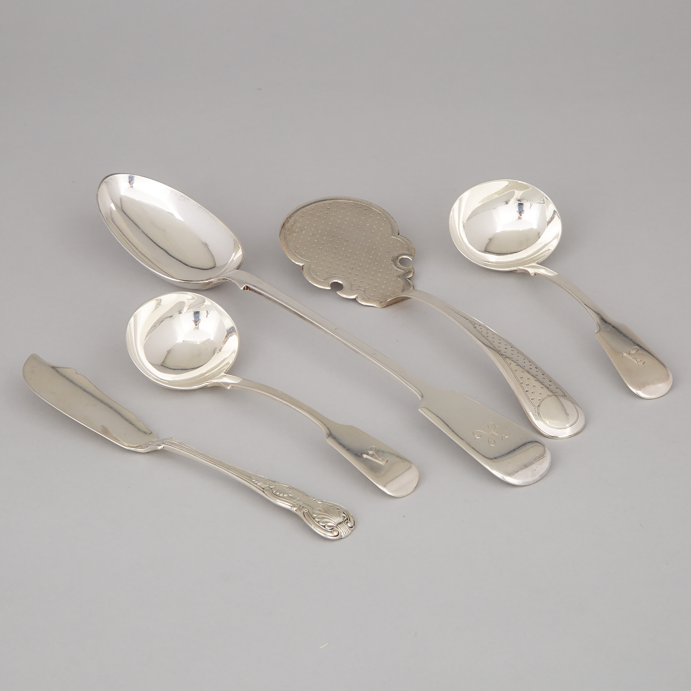 William IV Irish Silver Kings Pattern Butter Knife, Philip Weekes, Dublin, 1833, Pair of Fiddle Pattern Gravy Ladles, John, Henry & Charles Lias, London, 1835, Victorian Serving Spoon, Francis Higgins, 1861 and a Dutch Pastry Server, 1873
