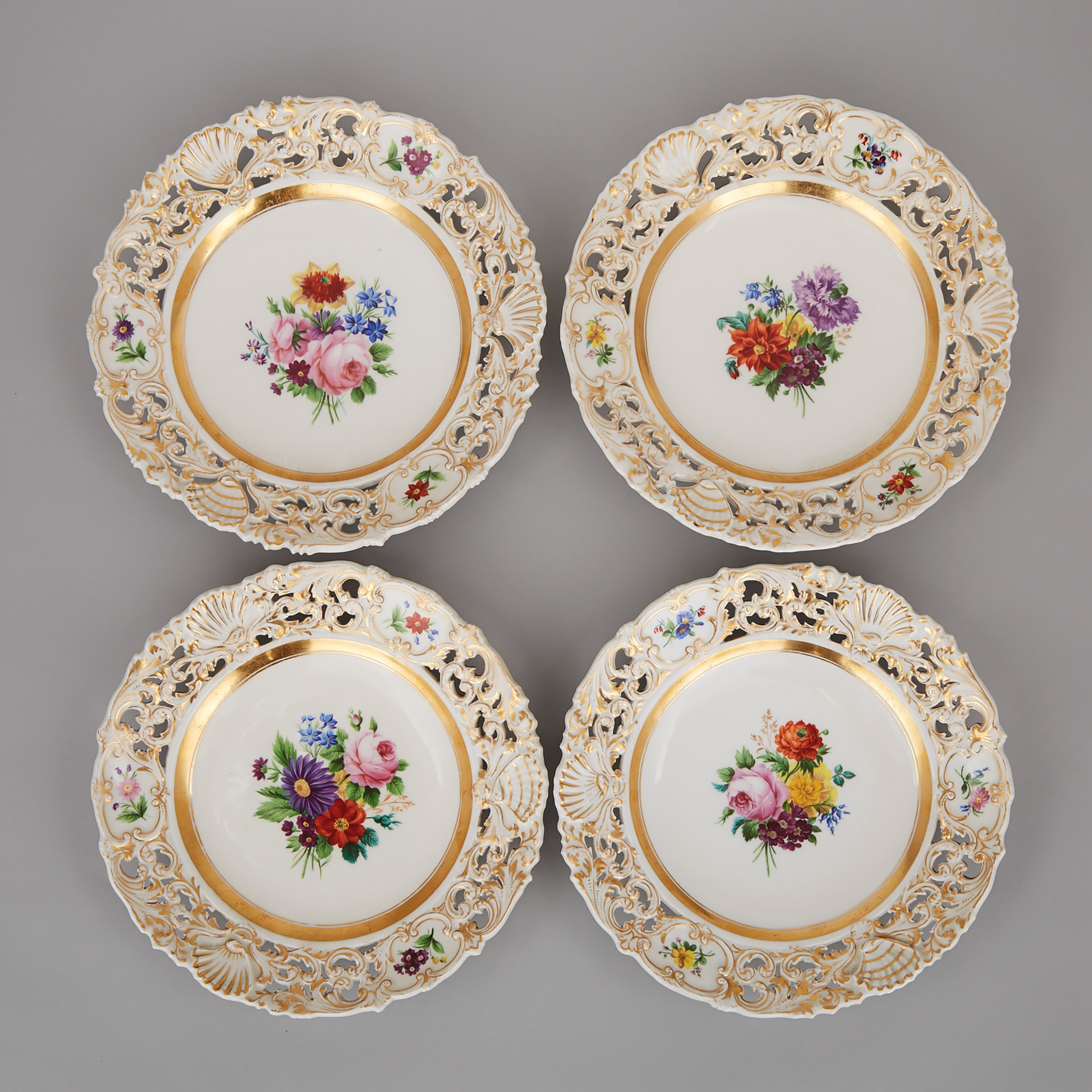 Four Vienna Flower-Painted and Gilt Reticulated Plates, 19th century
