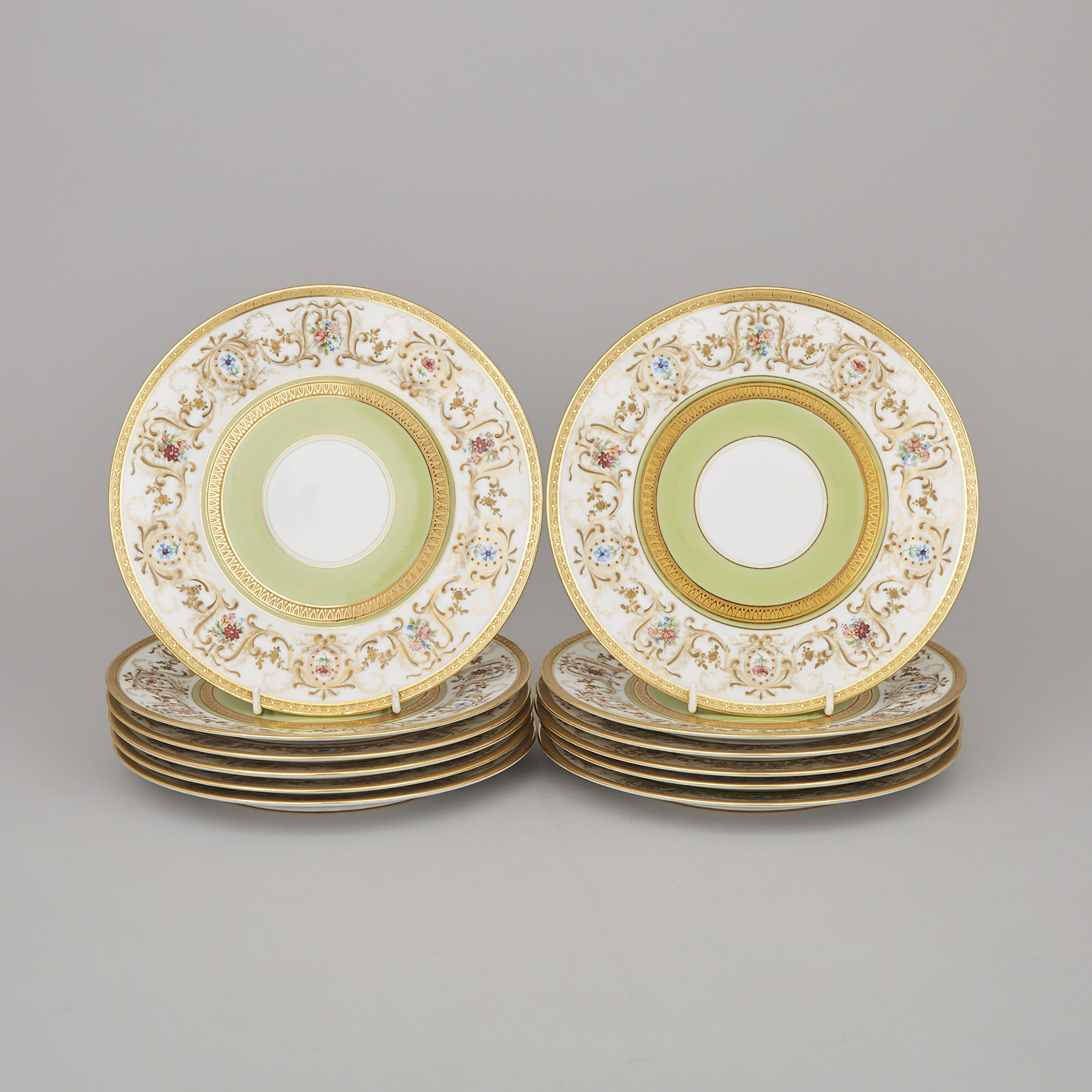 Twelve Charles Ahrenfeldt, Limoges Floral and Gilt Decorated and Apple Green Banded Dessert Plates, 20th century