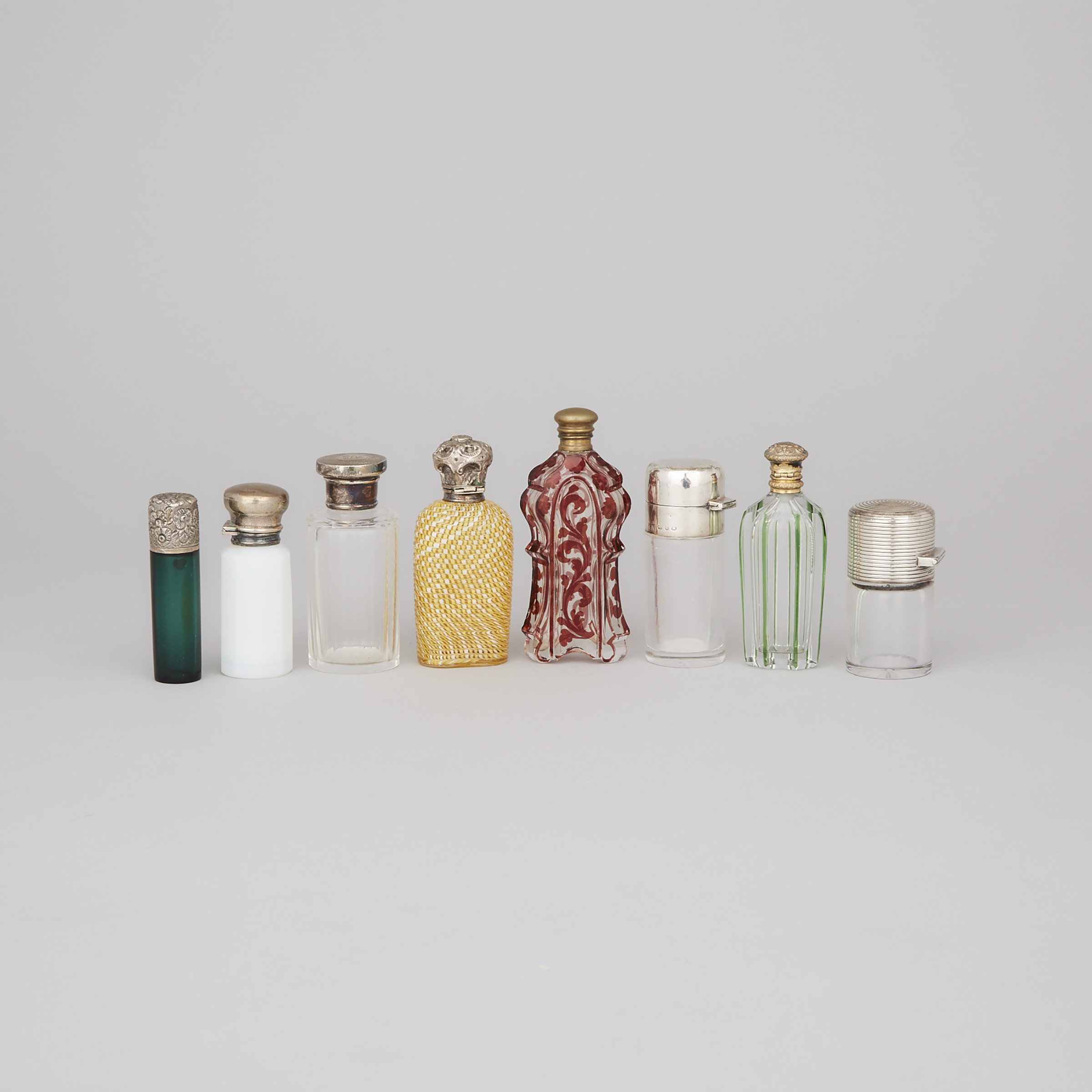 Eight Various Silver and Metal Mounted Glass Scent Bottles, late 19th/early 20th century
