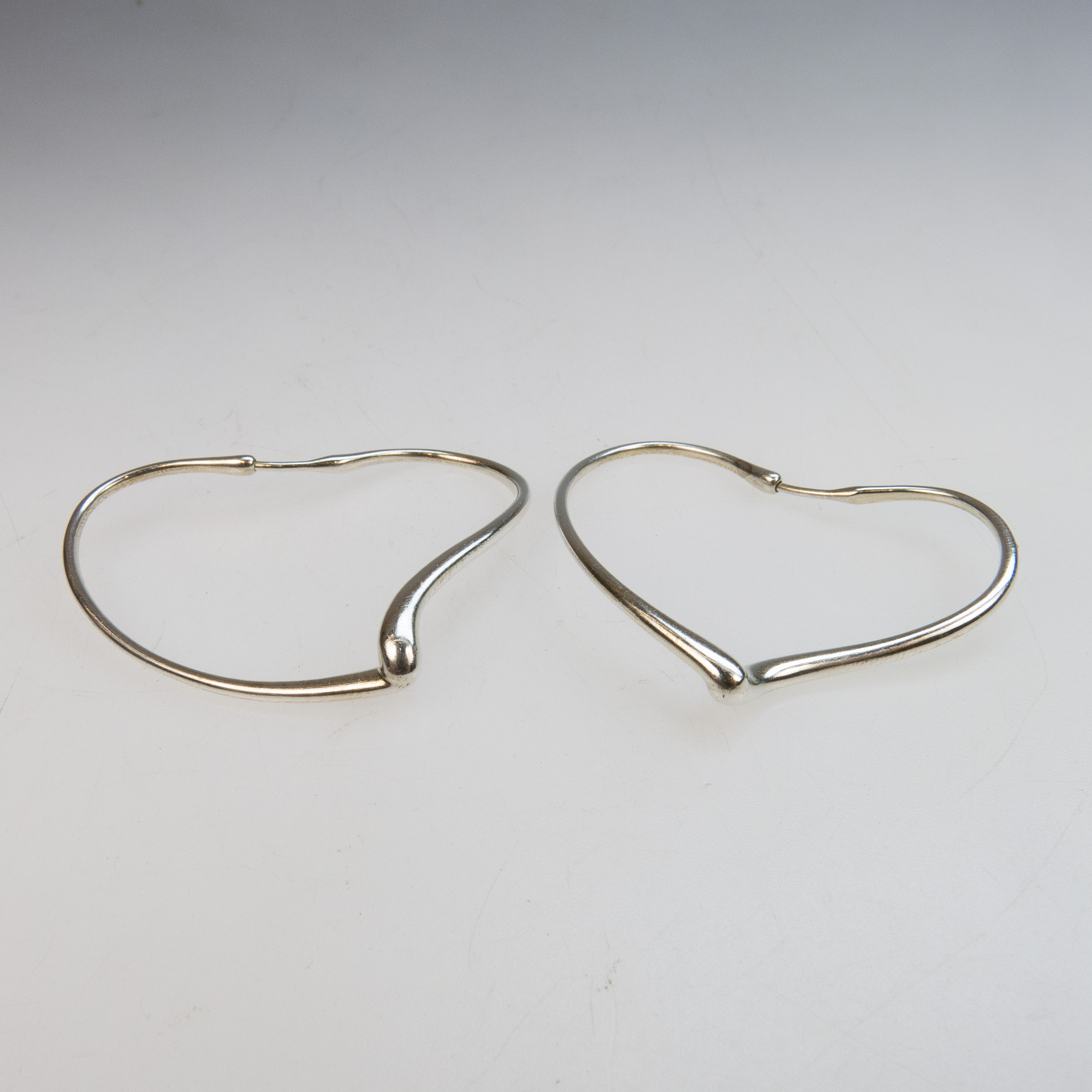 Pair Of Tiffany & Co. Elsa Peretti Sterling Silver Heart-Shaped Hoop Earrings