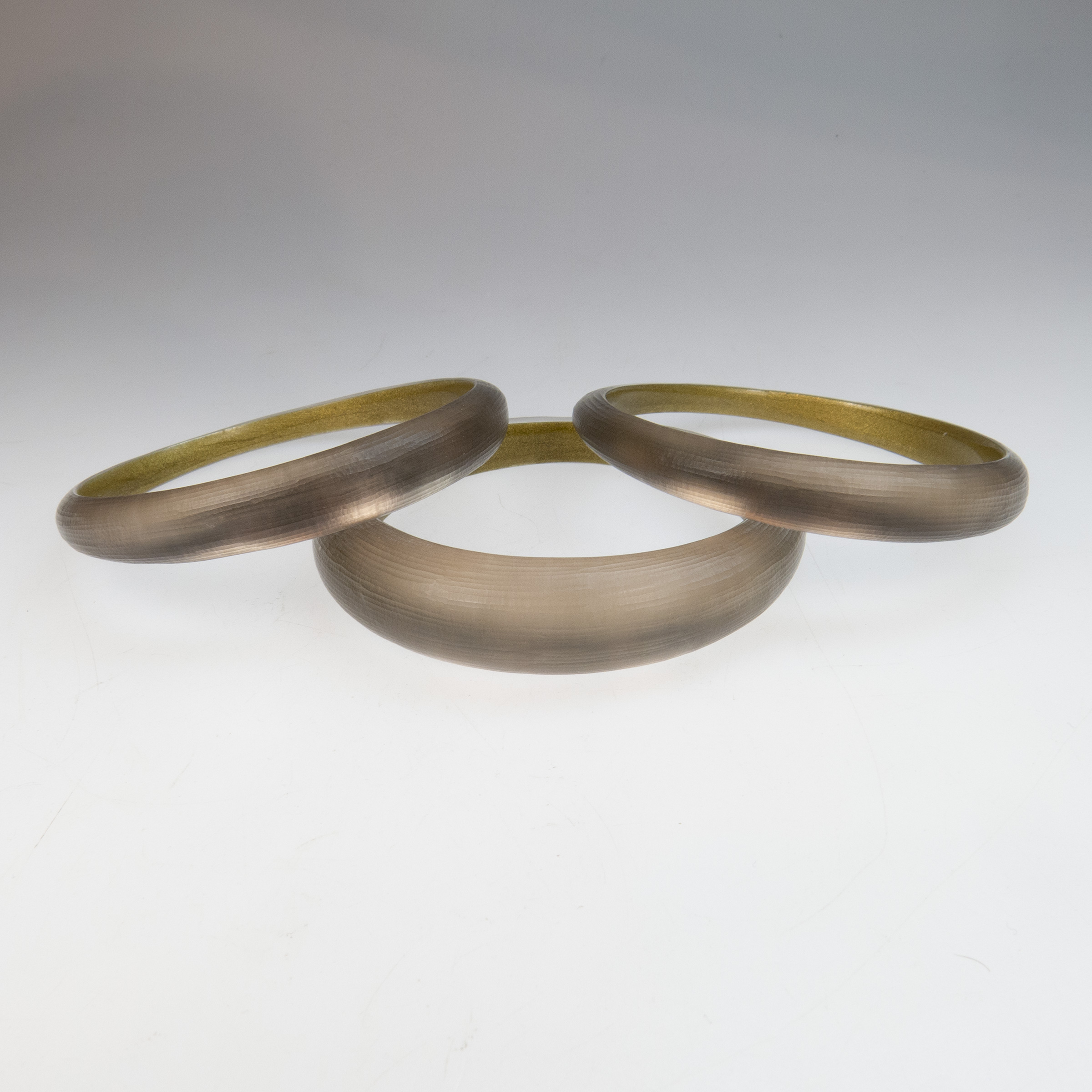 Three Alexis Bittar Carved Clear Lucite Bangles