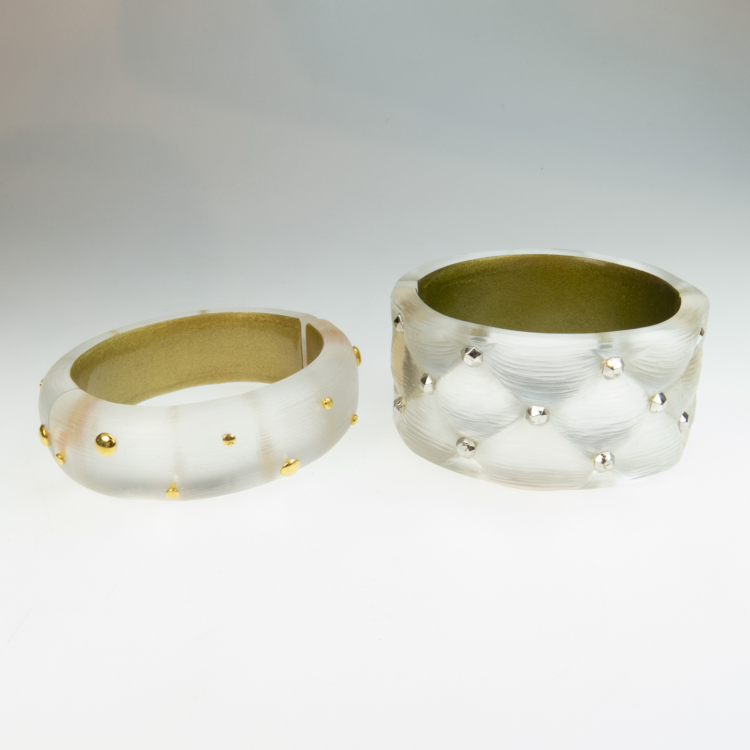 Two Alexis Bittar Clear Carved Lucite Spring Hinged Bangles