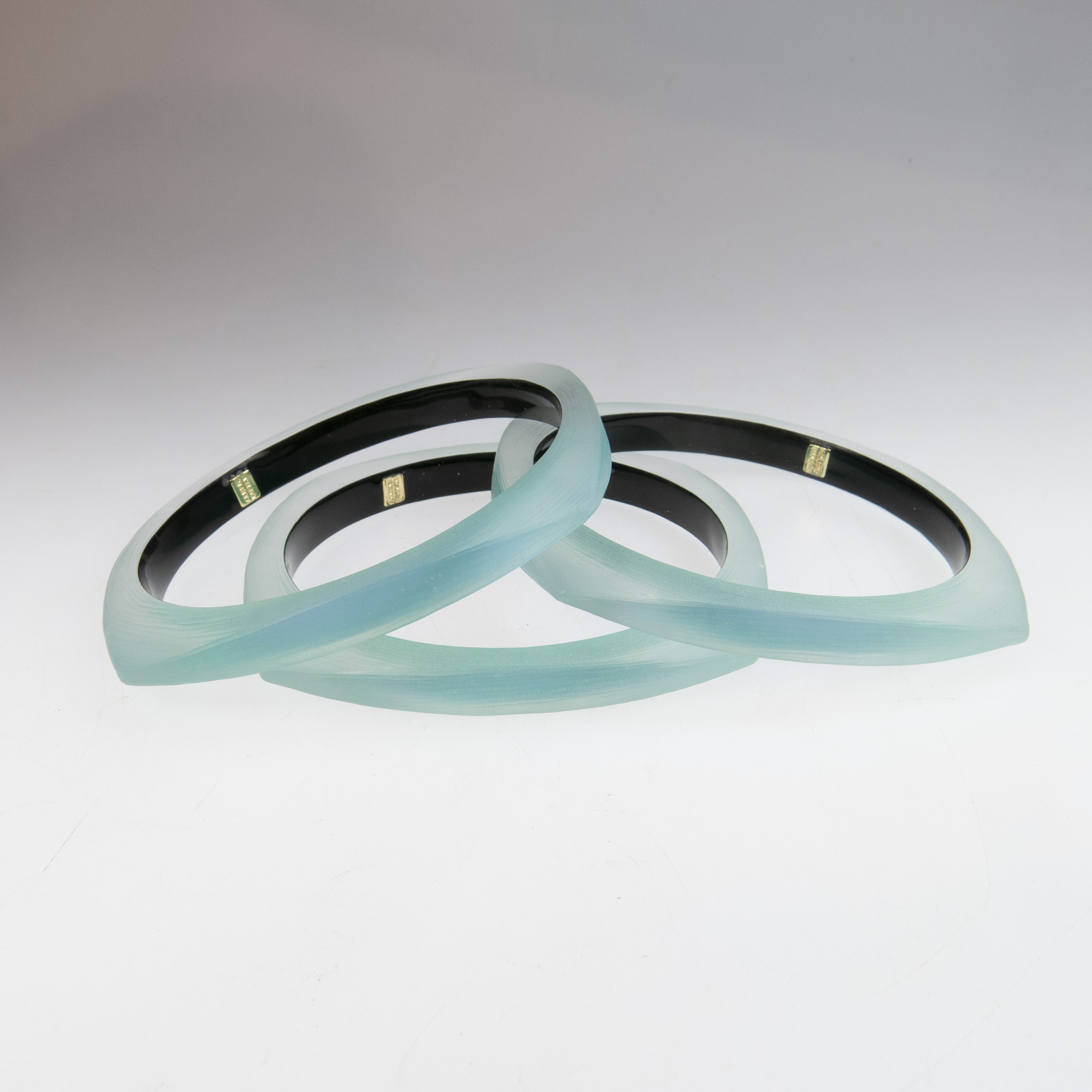 Three Alexis Bittar Carved Green Lucite Squared Bangles
