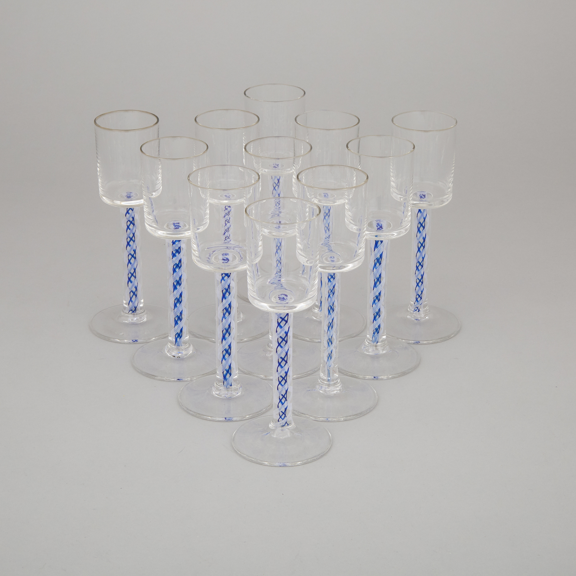 Set of Eleven Continental Blue and Opaque White Colour Twist Stemmed Wine Glasses, 20th century