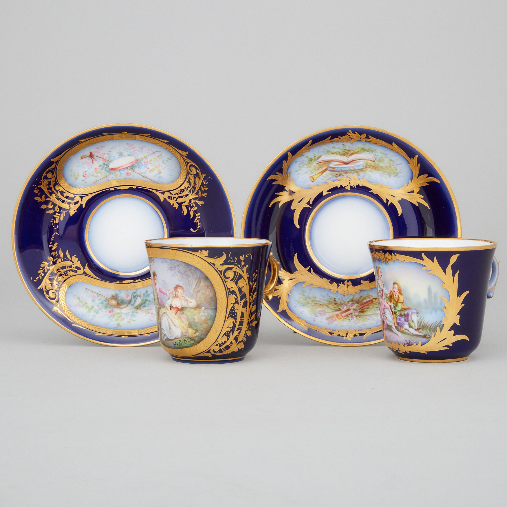 Two 'Sèvres' Blue Ground Cups and Saucers, late 19th century