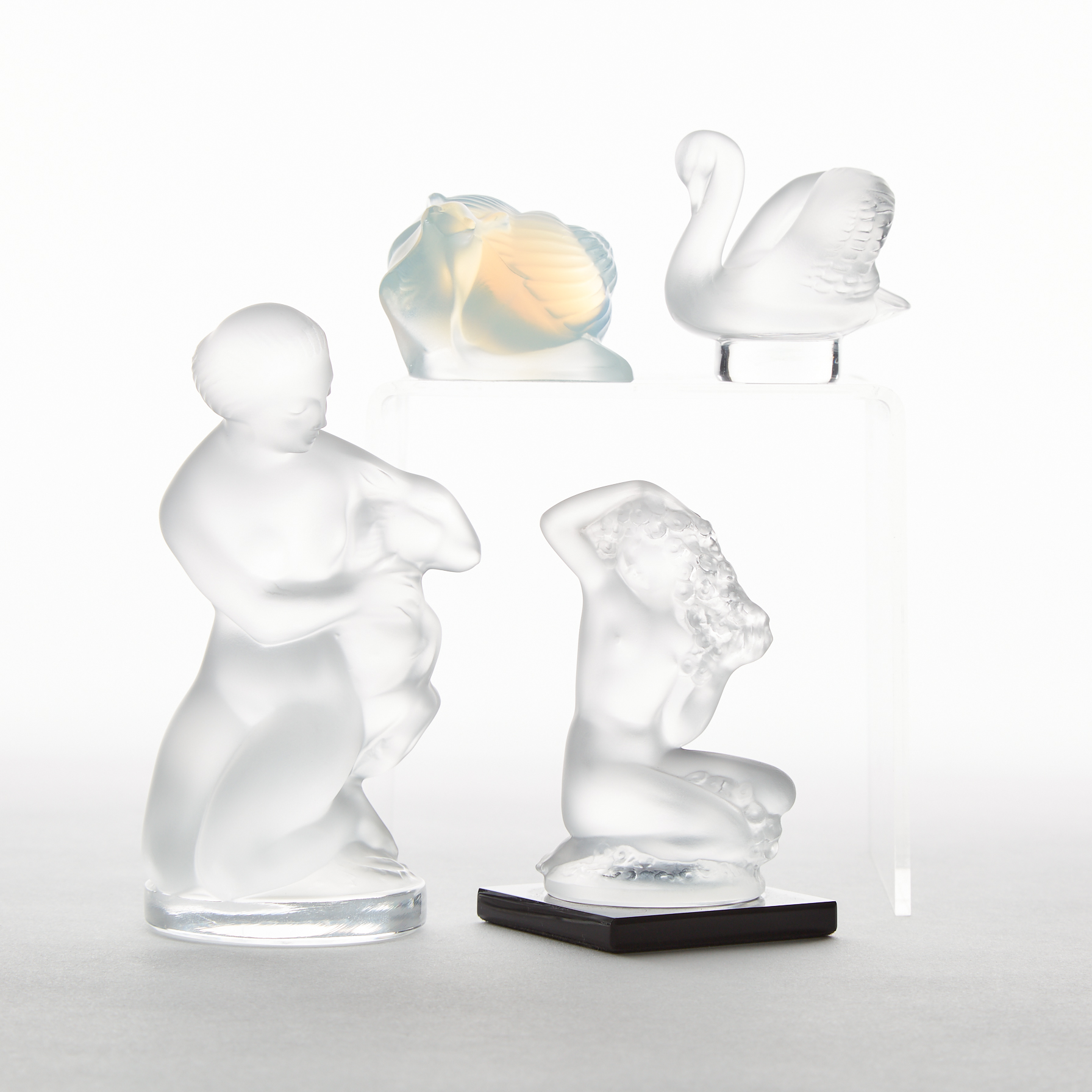Group of Four Lalique Moulded Glass Figures,  post-1945