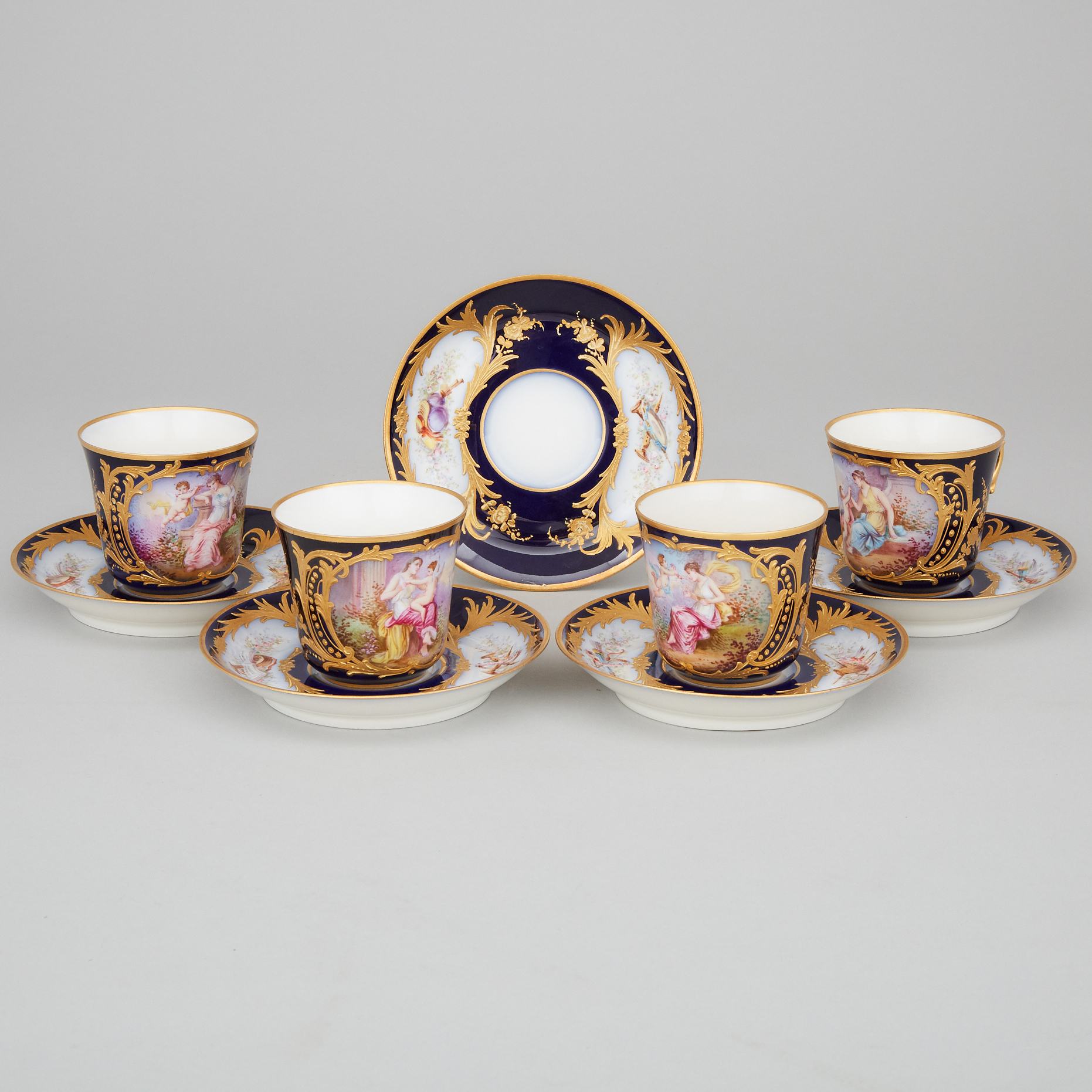 Four 'Sèvres' Blue Ground Cups and Five Saucers, F. Lacoste, late 19th century