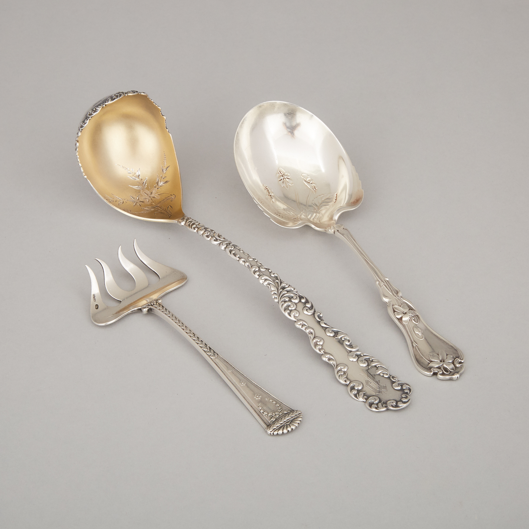 American Silver Punch Ladle, R. Wallace & Sons, Wallingford, Ct., Berry Spoon, Whiting Mfg. Co., New York, N.Y., and a Russian Sardine Fork, Bolin, Moscow, c.1900