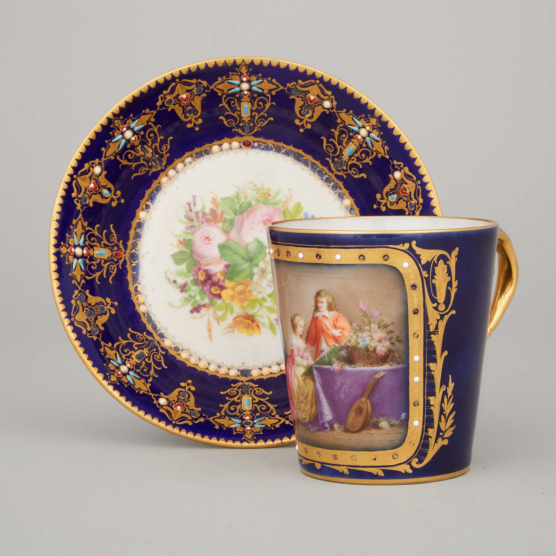 'Sèvres' 'Jeweled' Blue Ground Cup and a Saucer, late 19th/early 20th century