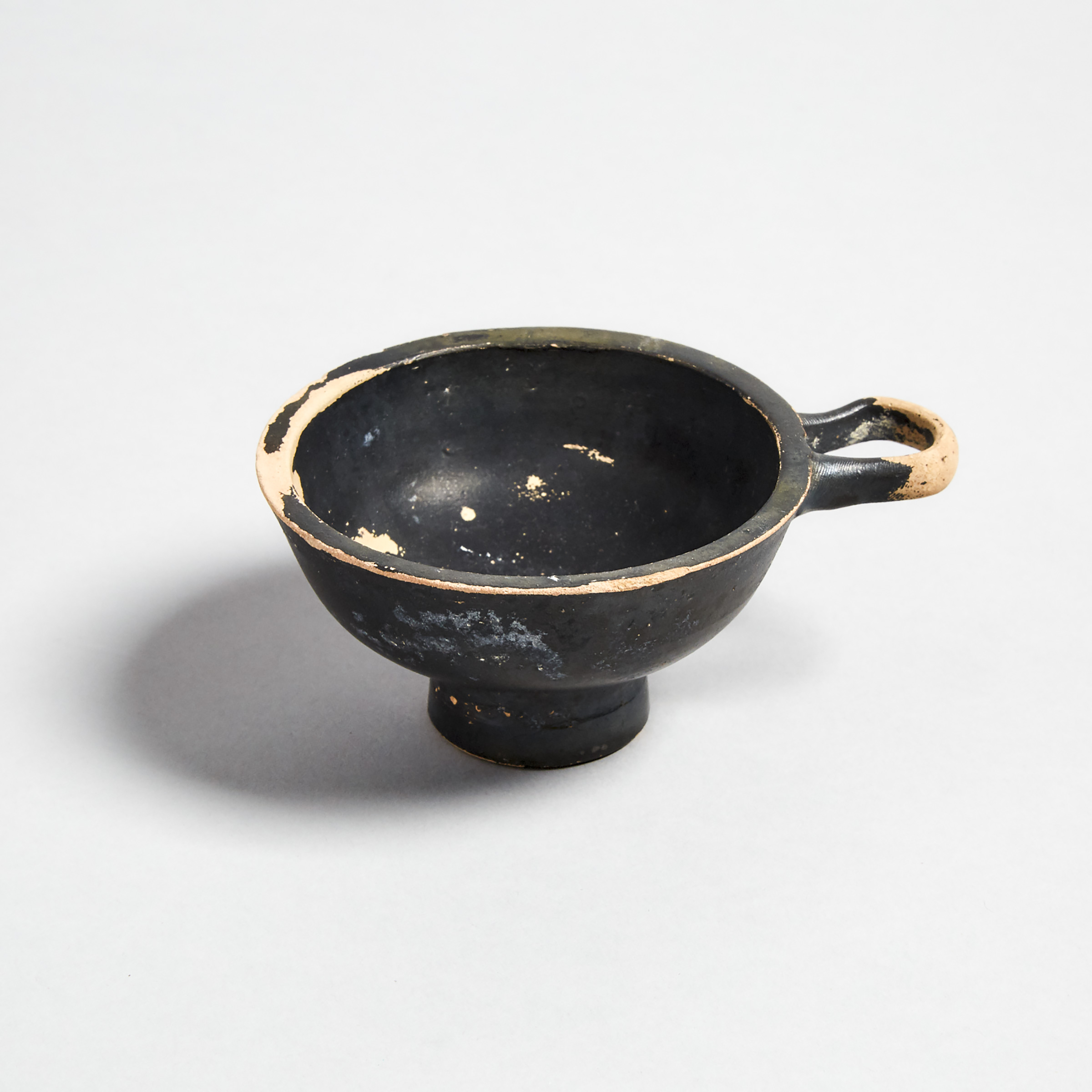 Greek Apulian Gnathian Blackware Footed Wine Cup, 4th-3rd century B.C.
