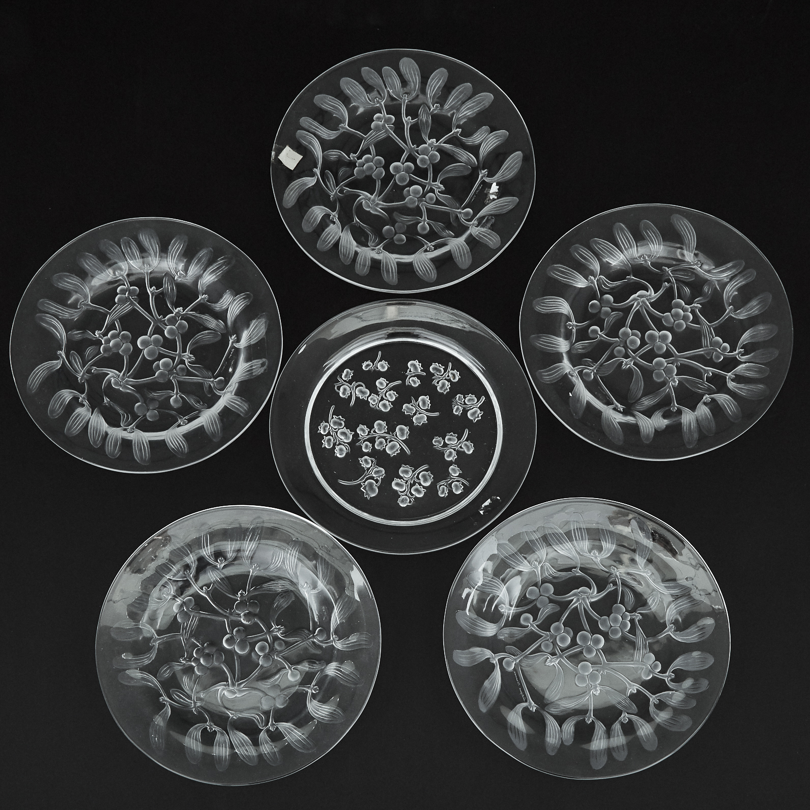 'Gui', Five Lalique Moulded and Partly Frosted Glass Plates and another, 'Muguet', post-1945