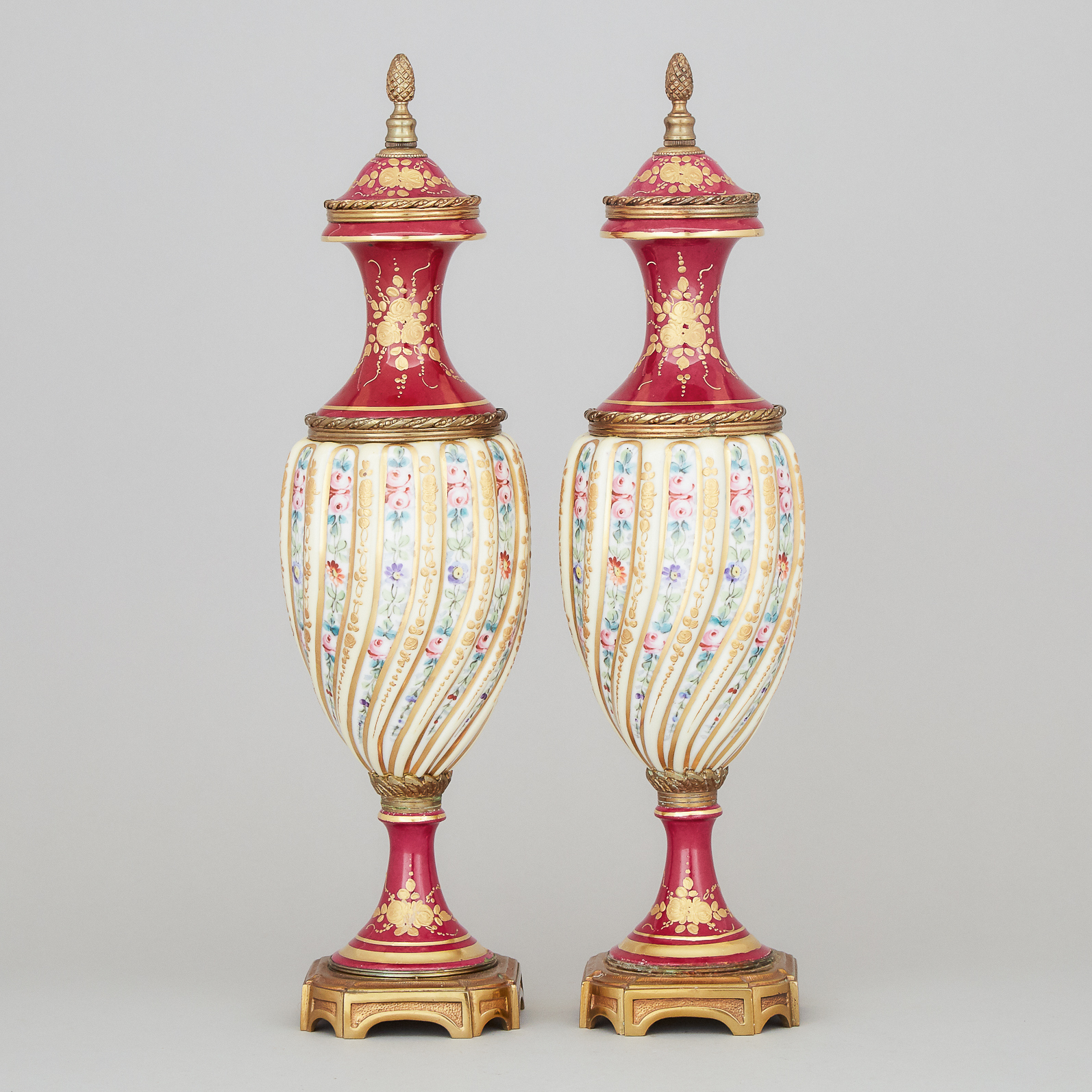 Pair of 'Sèvres' Claret-Ground Gilt Metal Mounted Urns, late 19th century