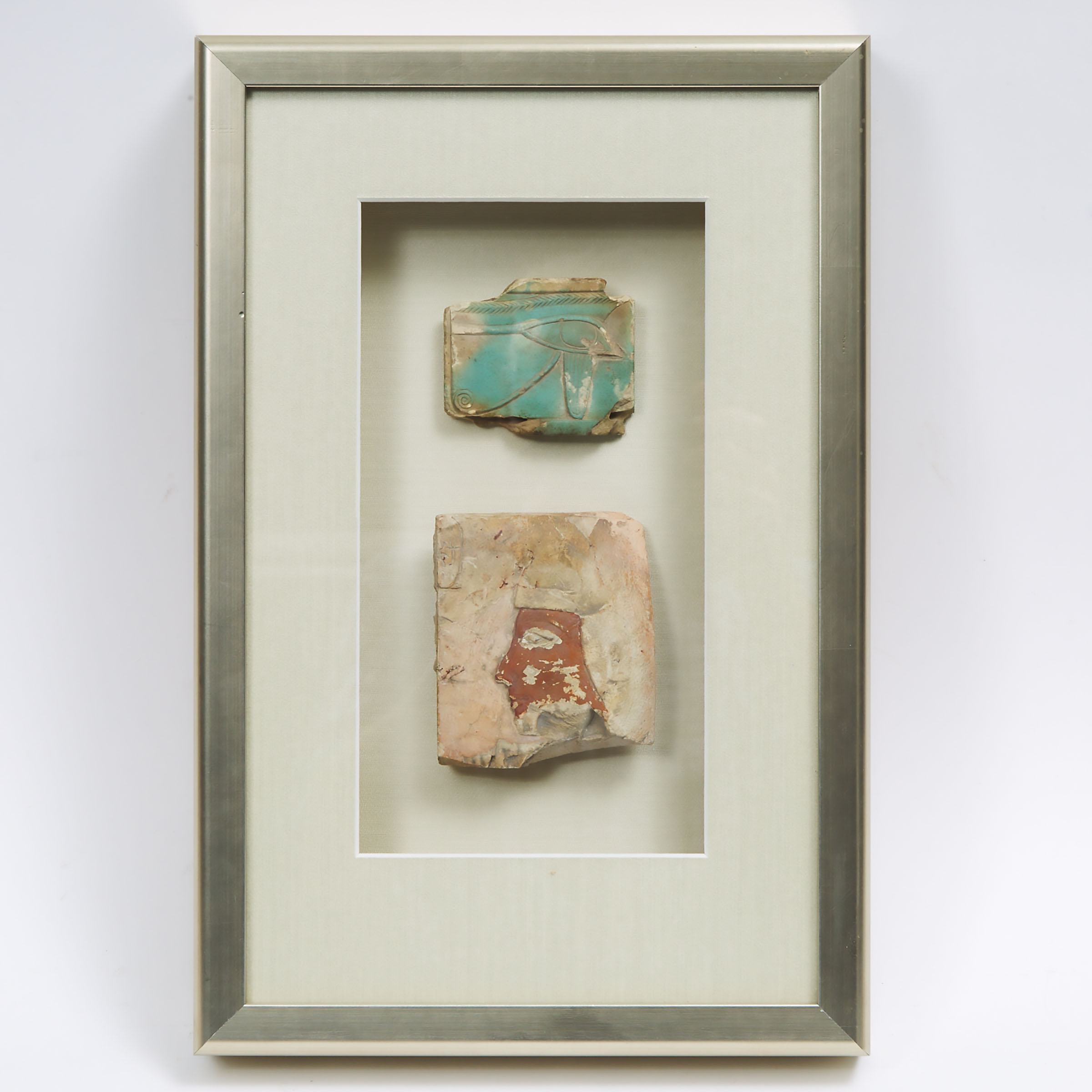 Egyptian Faience Eye of Horus Tile and a Painted Limestone Relief Wall Fragment, Middle Kingdom - Third Intermediate Period